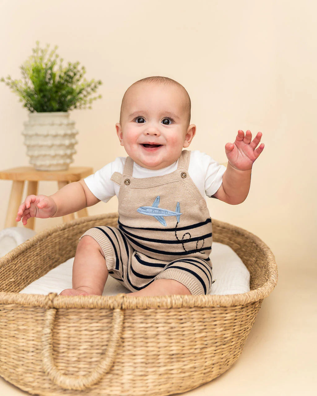 Baby boy organic knit romper set featuring embroidered airplane design and matching short sleeve bodysuit.