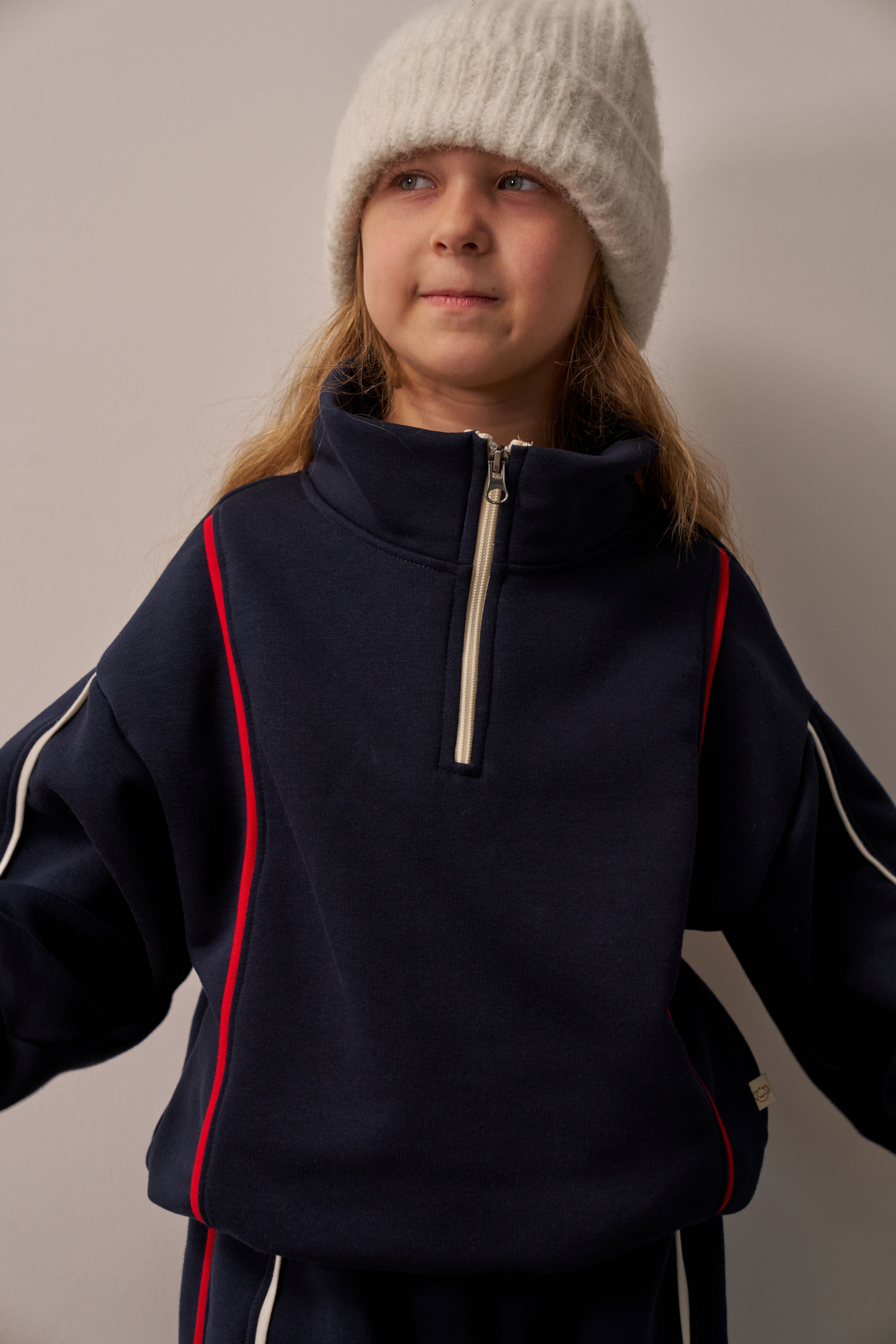 Soft cotton navy jogger set for kids with zipper top and relaxed fit.