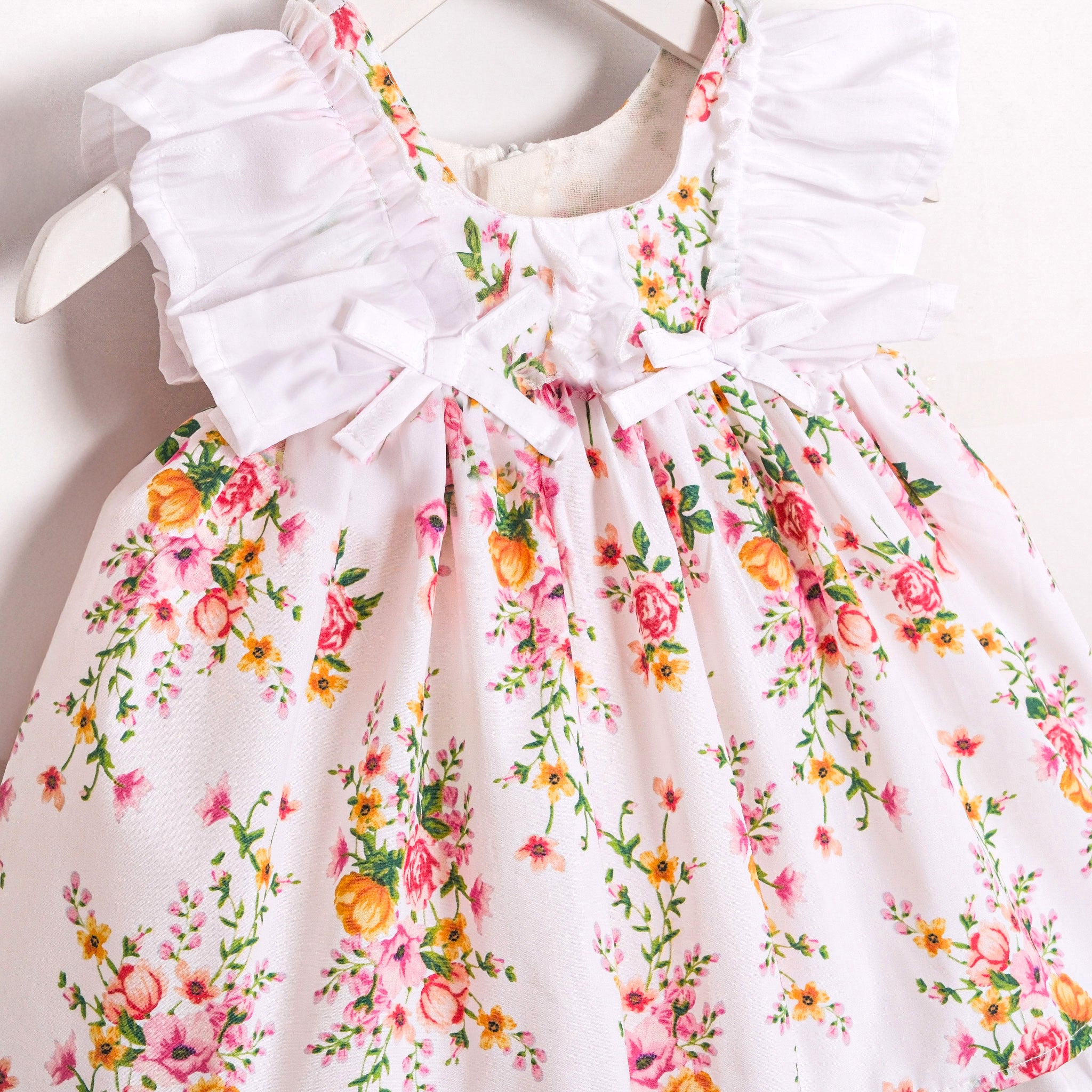 Elegant baby girl floral dress with ruffle shoulder detail