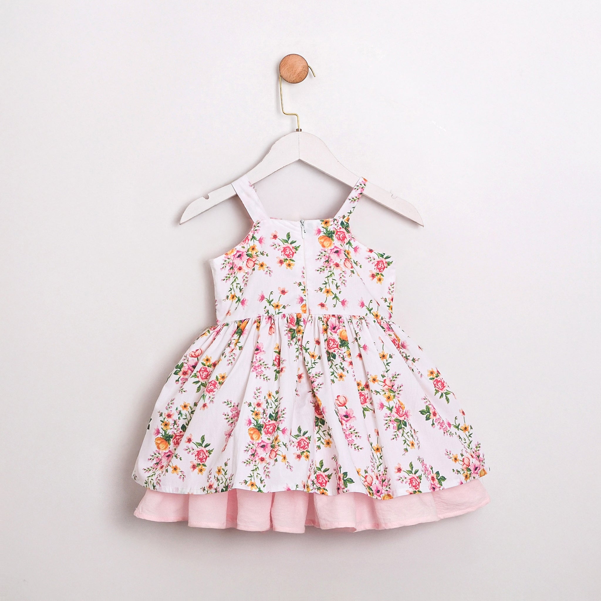 Floral baby dress with lace detail and bow tie straps