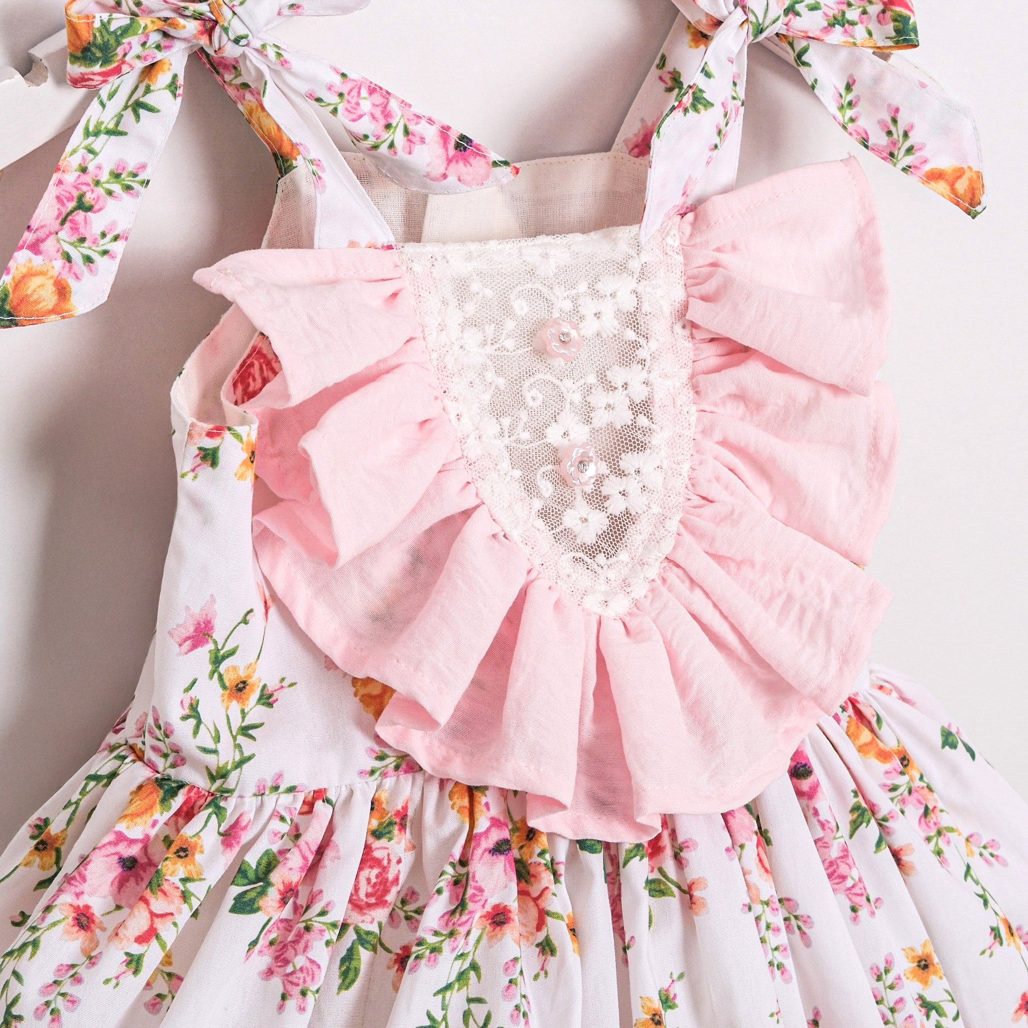 Boutique baby girl dress with pink ruffles and floral print