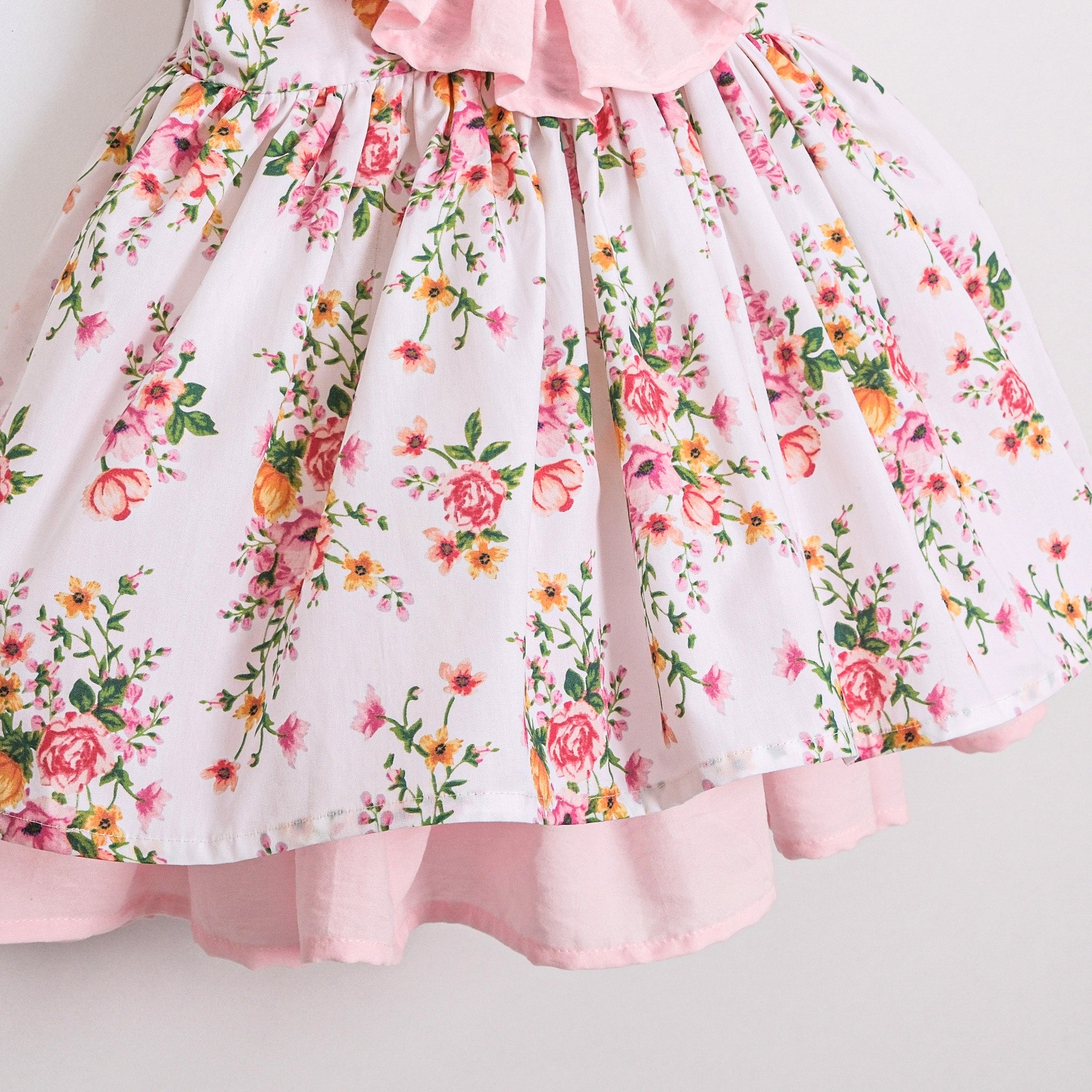 Elegant baby girl floral dress with layered pink hem