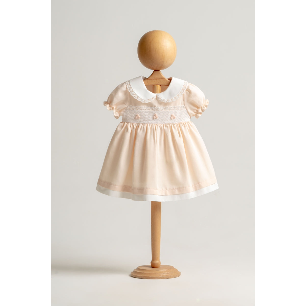 Peach baby dress with Peter Pan collar