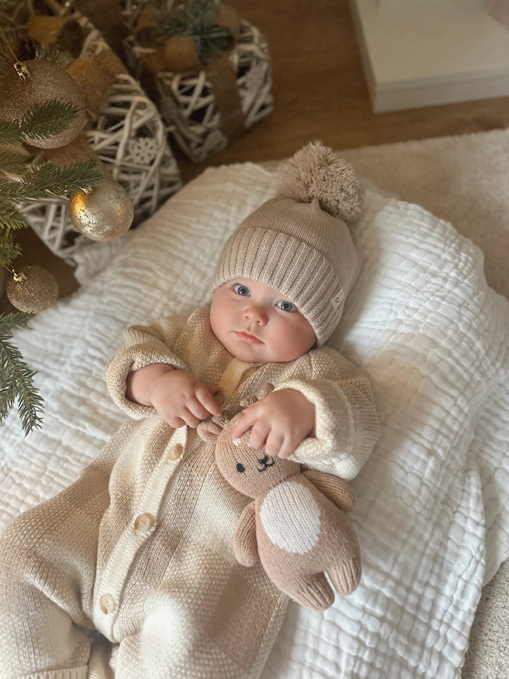 Cozy knit baby jumpsuit with front button closure