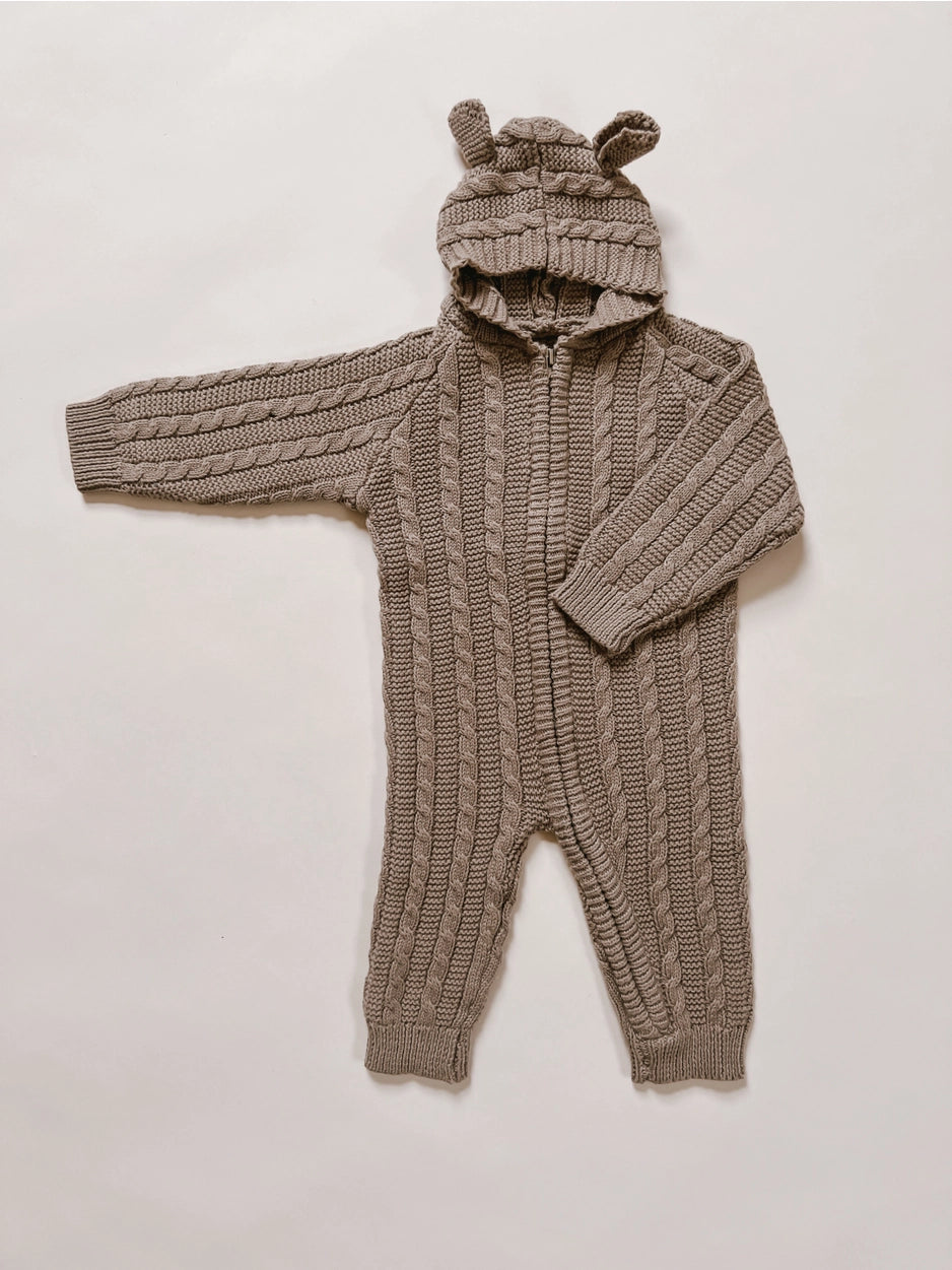 Organic cotton knit hooded baby jumpsuit with bear ears.
