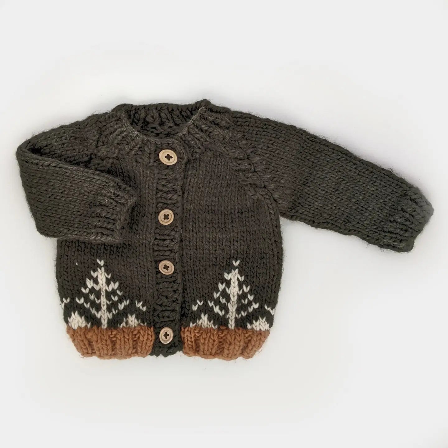 Hand-knitted dark brown baby cardigan with wooden buttons and white tree pattern detail.