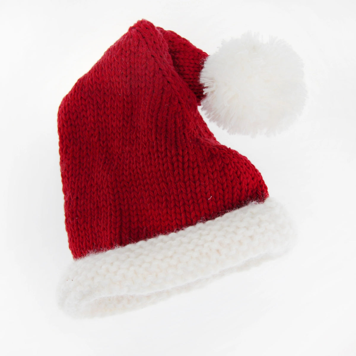 red knit santa hat with soft white brim and pom pom