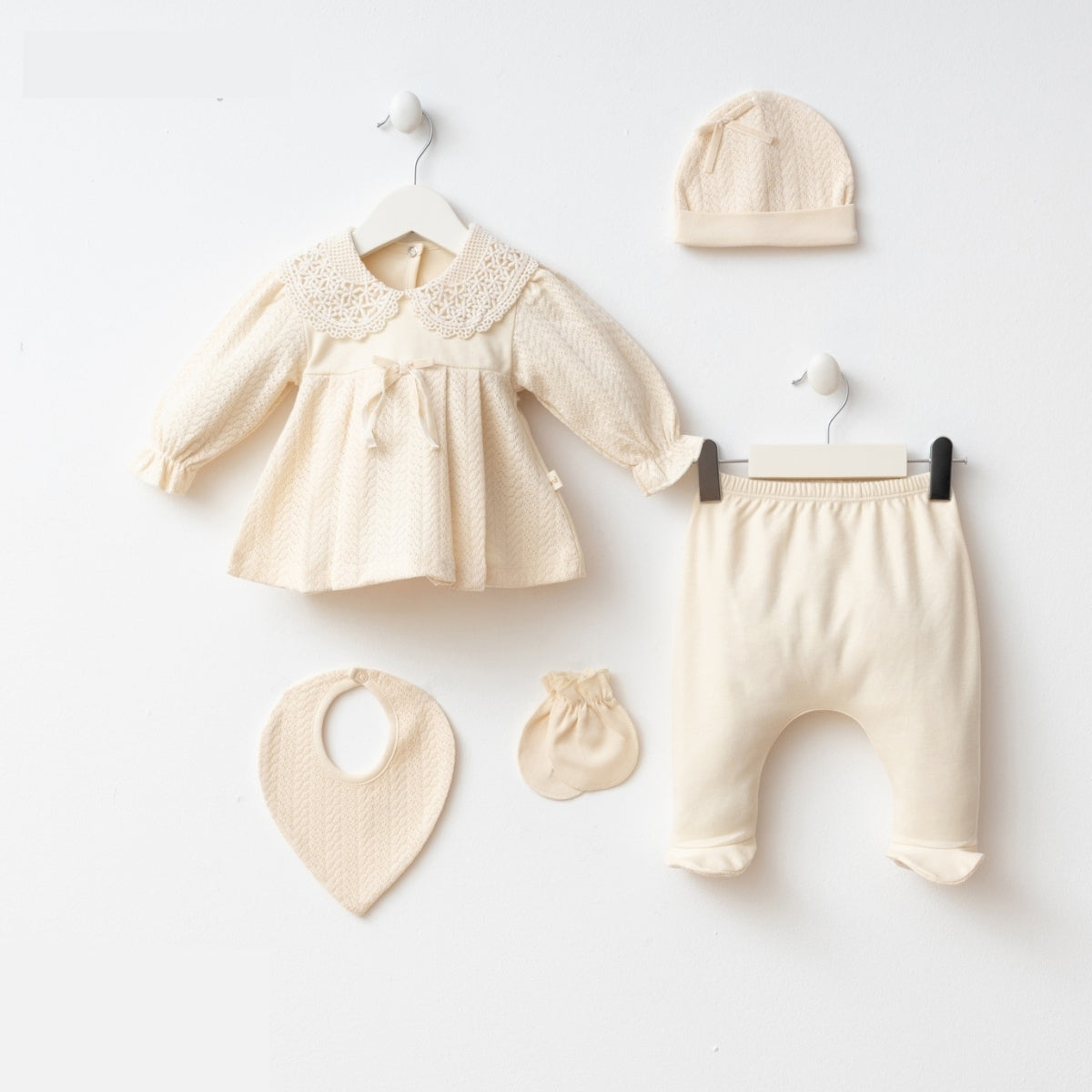 Cream newborn 5-piece baby set with lace collar top and accessories