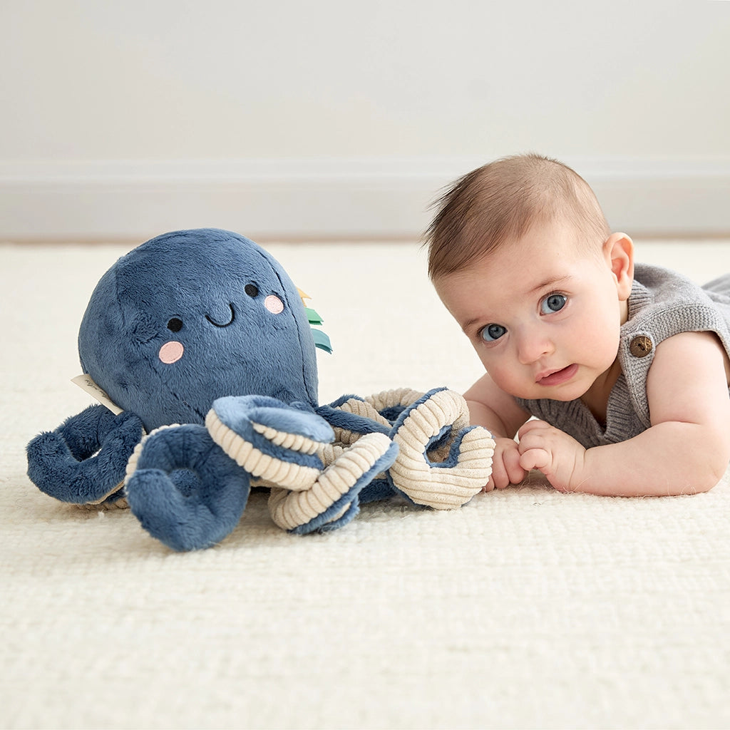 Soft blue baby octopus plush with textured tentacles