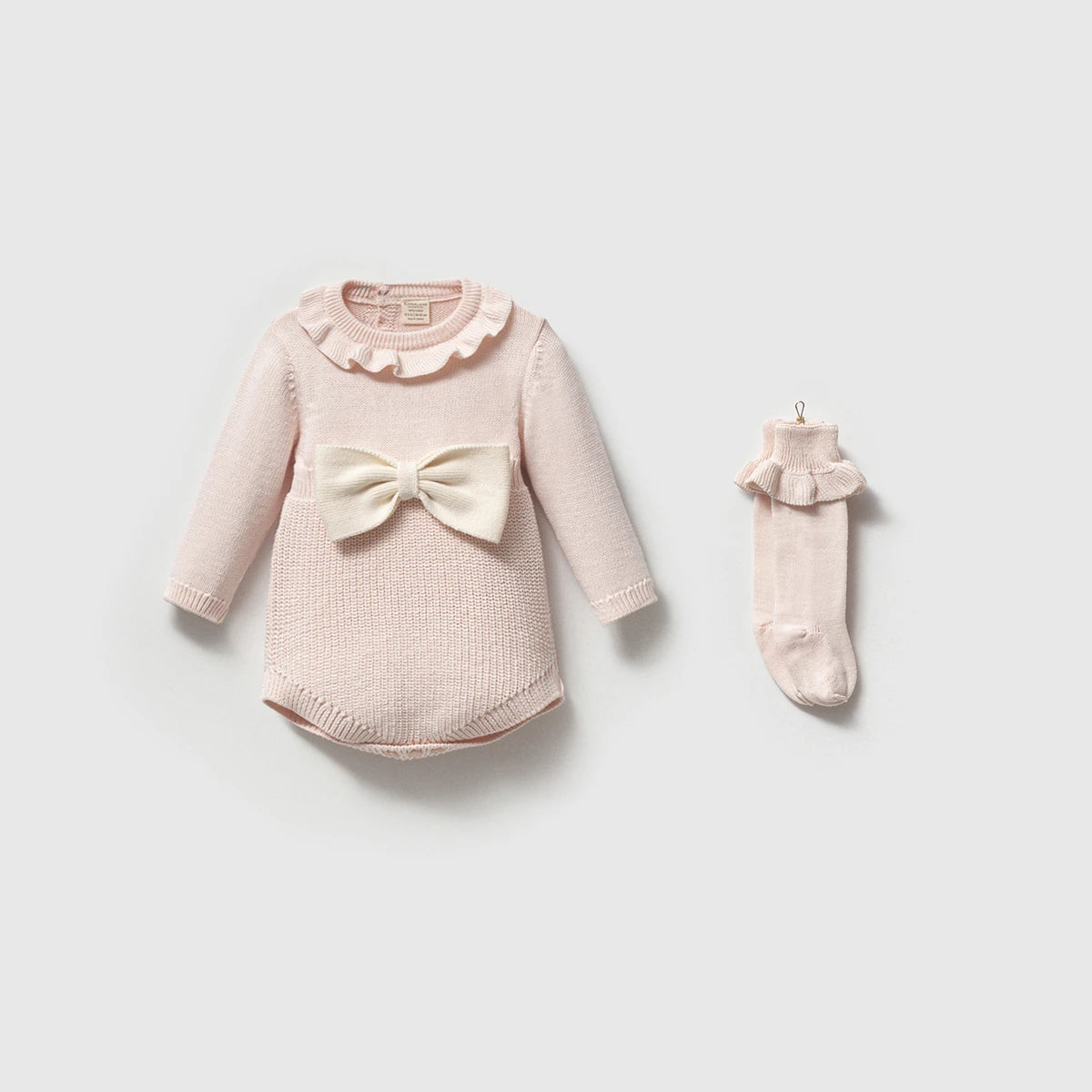 Baby girl knit romper with bow and ruffle collar