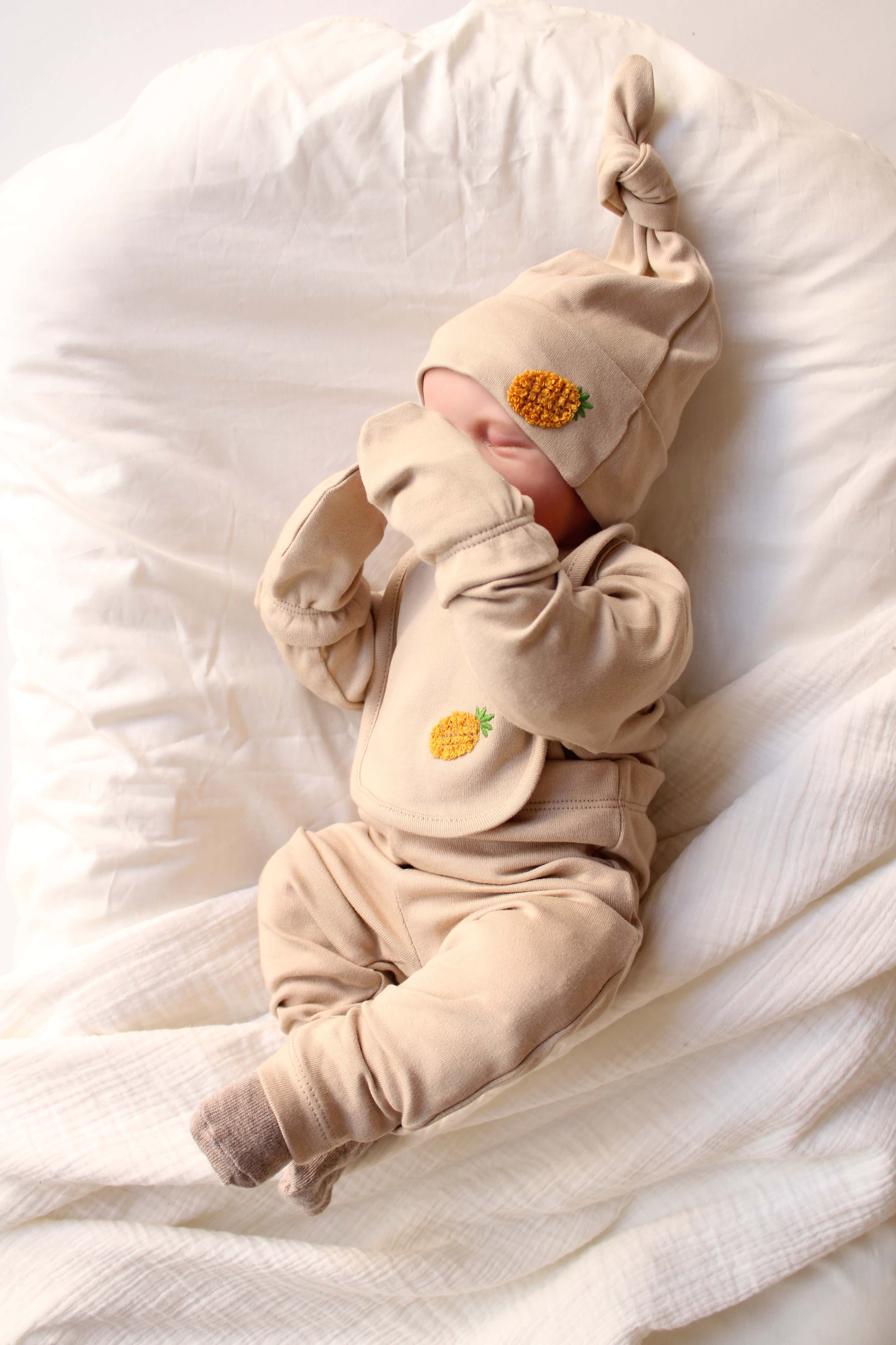 Adorable pineapple design 5 piece layette set for newborns, perfect baby shower gift idea.