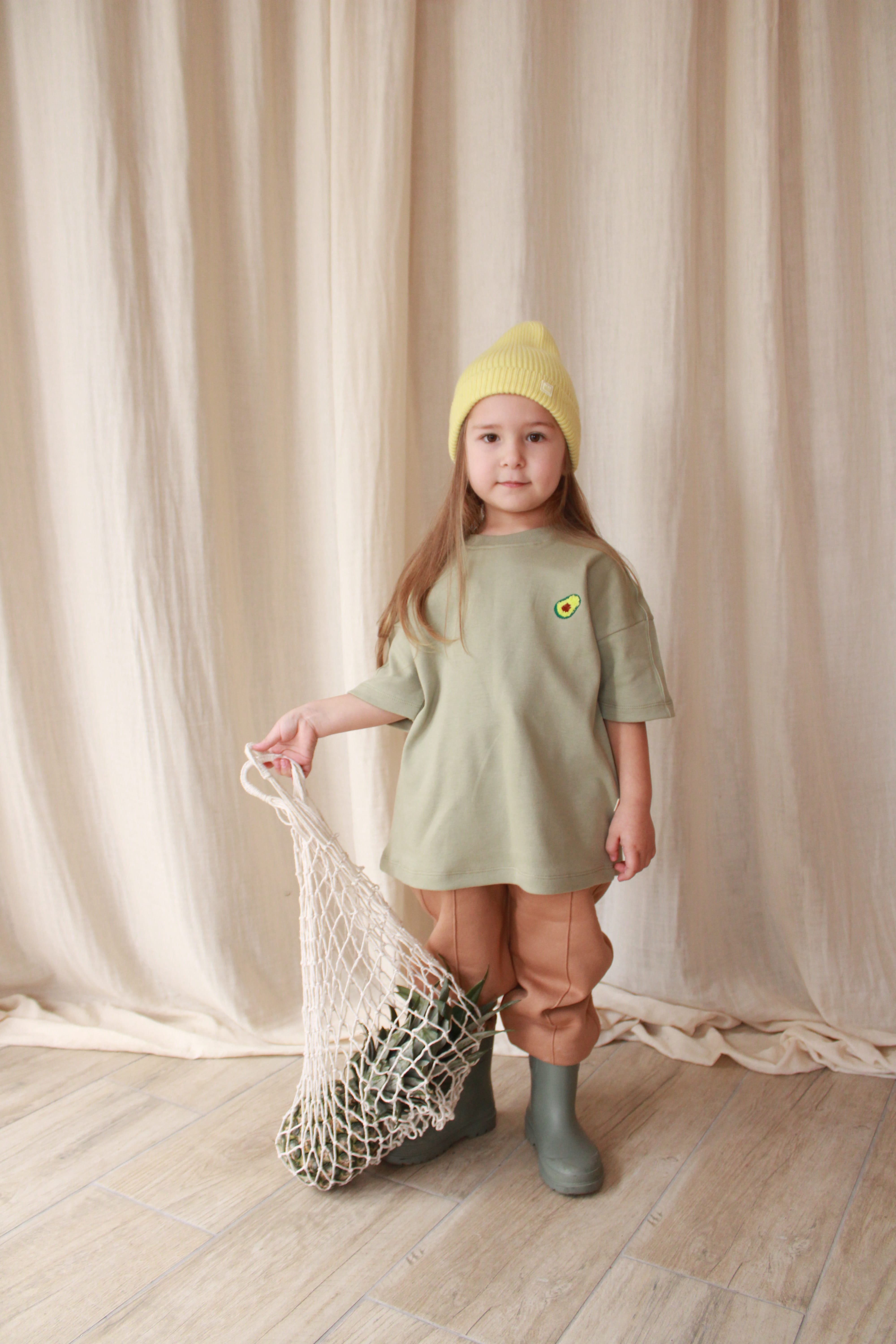 Oversize avocado print baby t-shirt made from soft cotton, unisex toddler summer outfit.