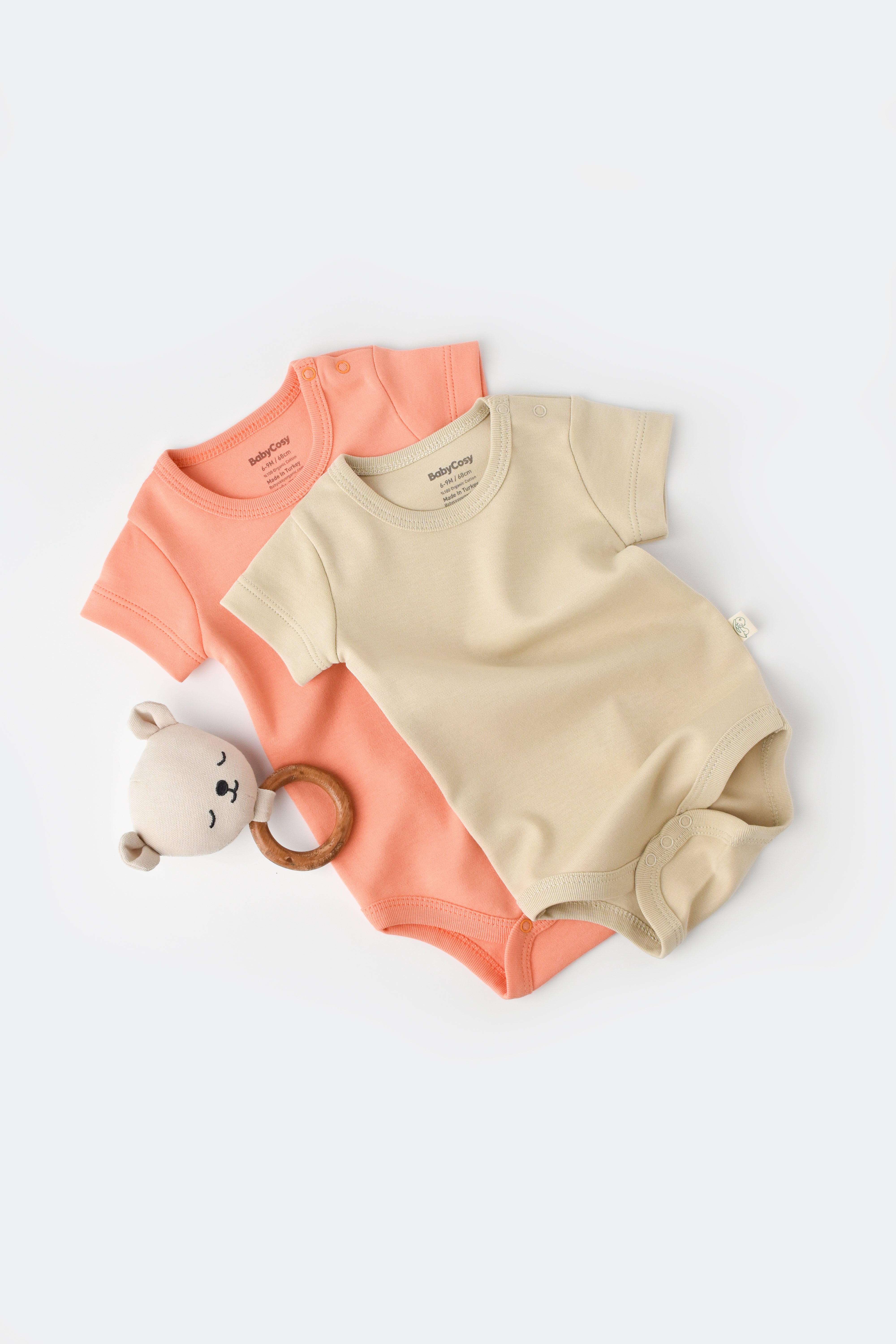 Two pack short sleeve baby bodysuits made from 100% organic cotton, breathable infant essentials