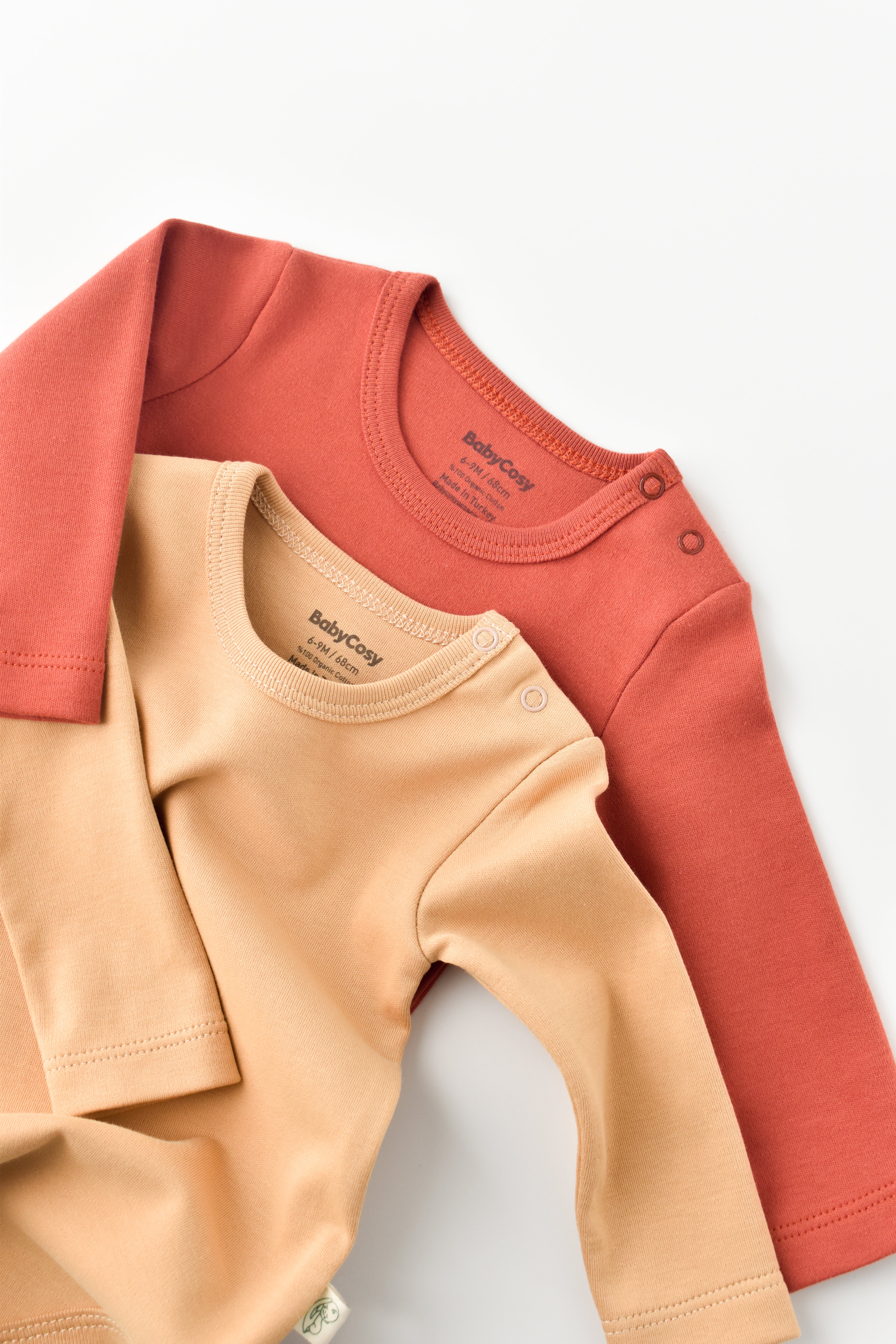 Unisex organic cotton long sleeve bodysuit 2-pack, breathable and durable essentials for infants.