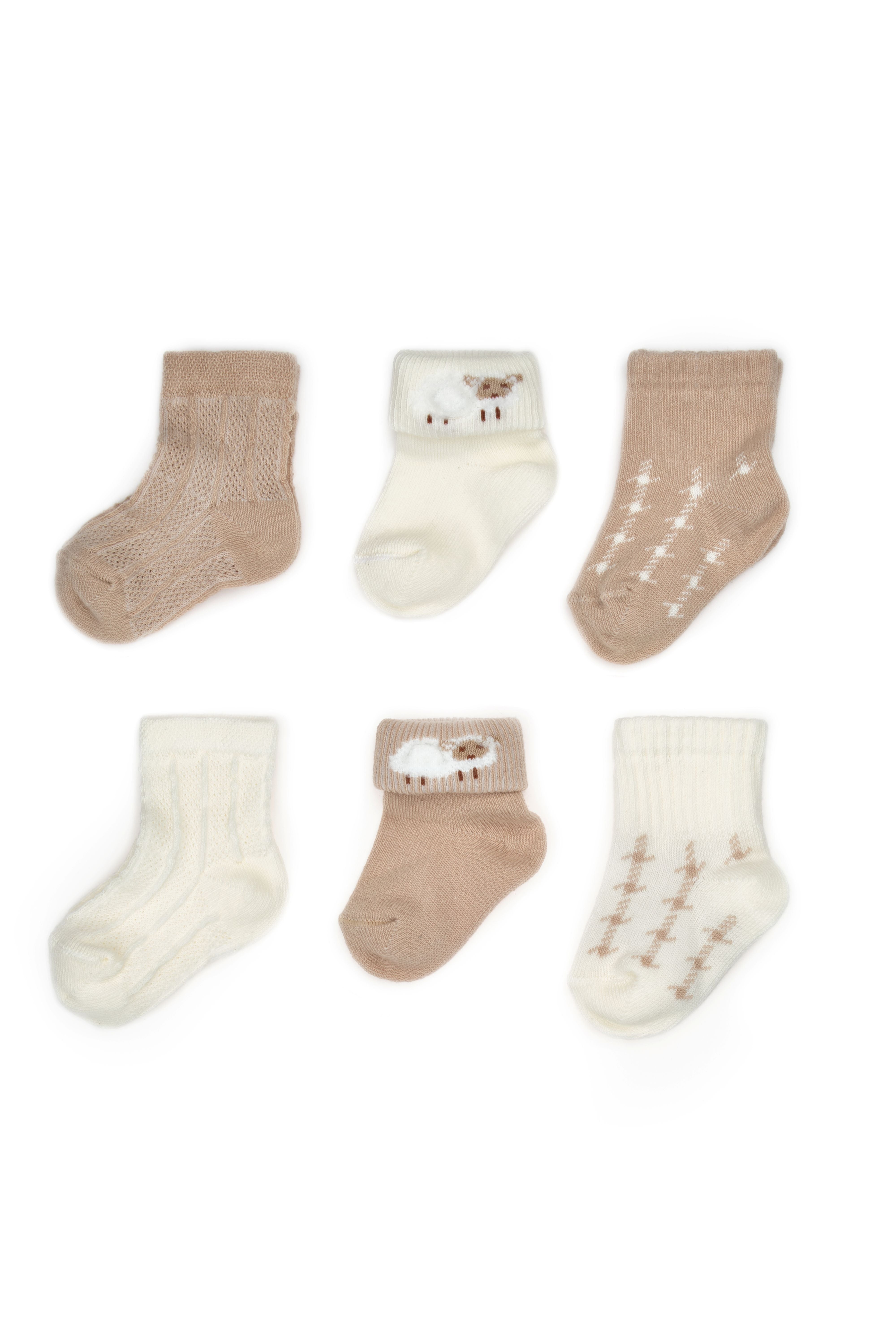 Neutral newborn baby clothing essentials in soft organic fabric