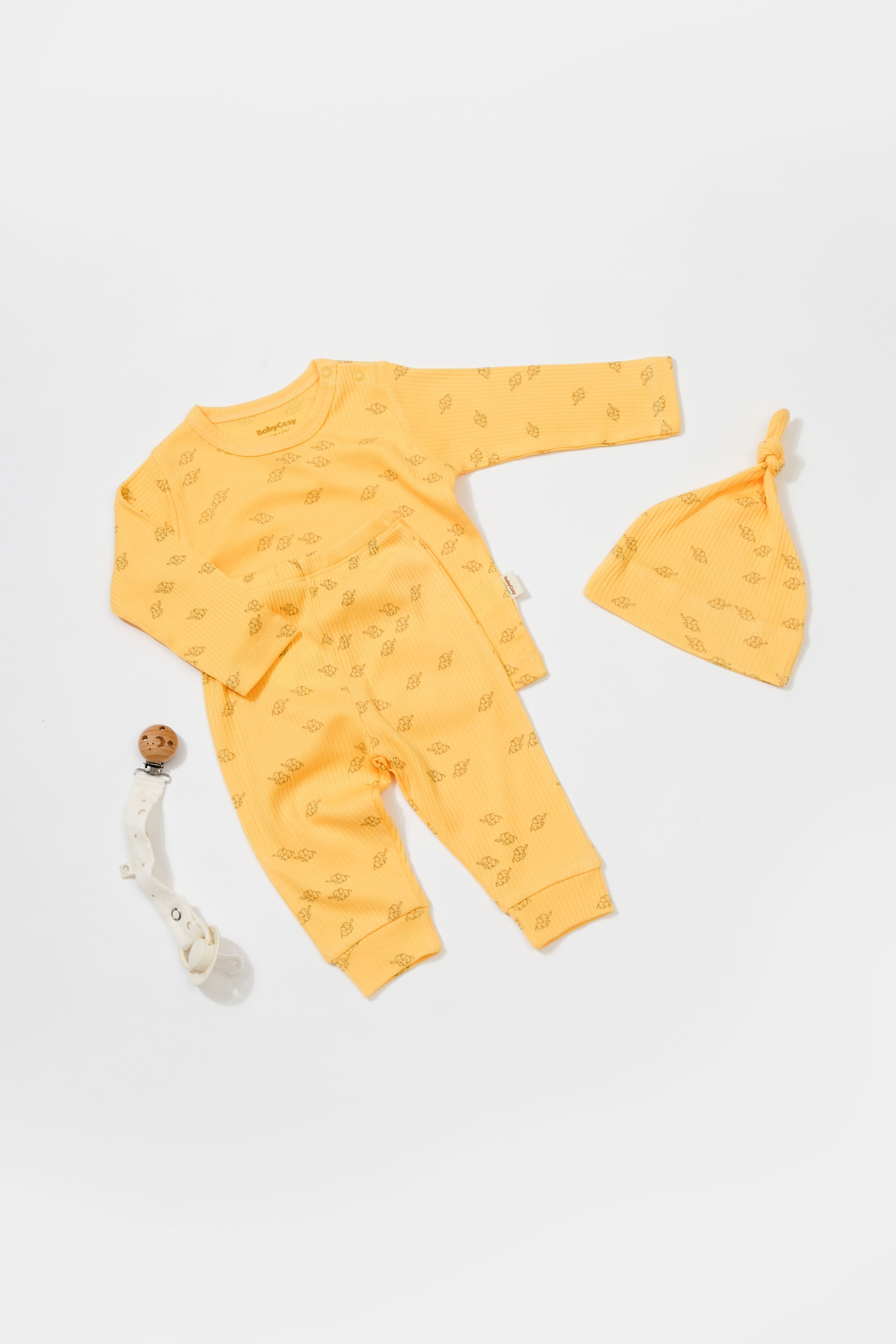 Three piece yellow elephant baby clothing set, soft cotton outfit for newborn comfort.