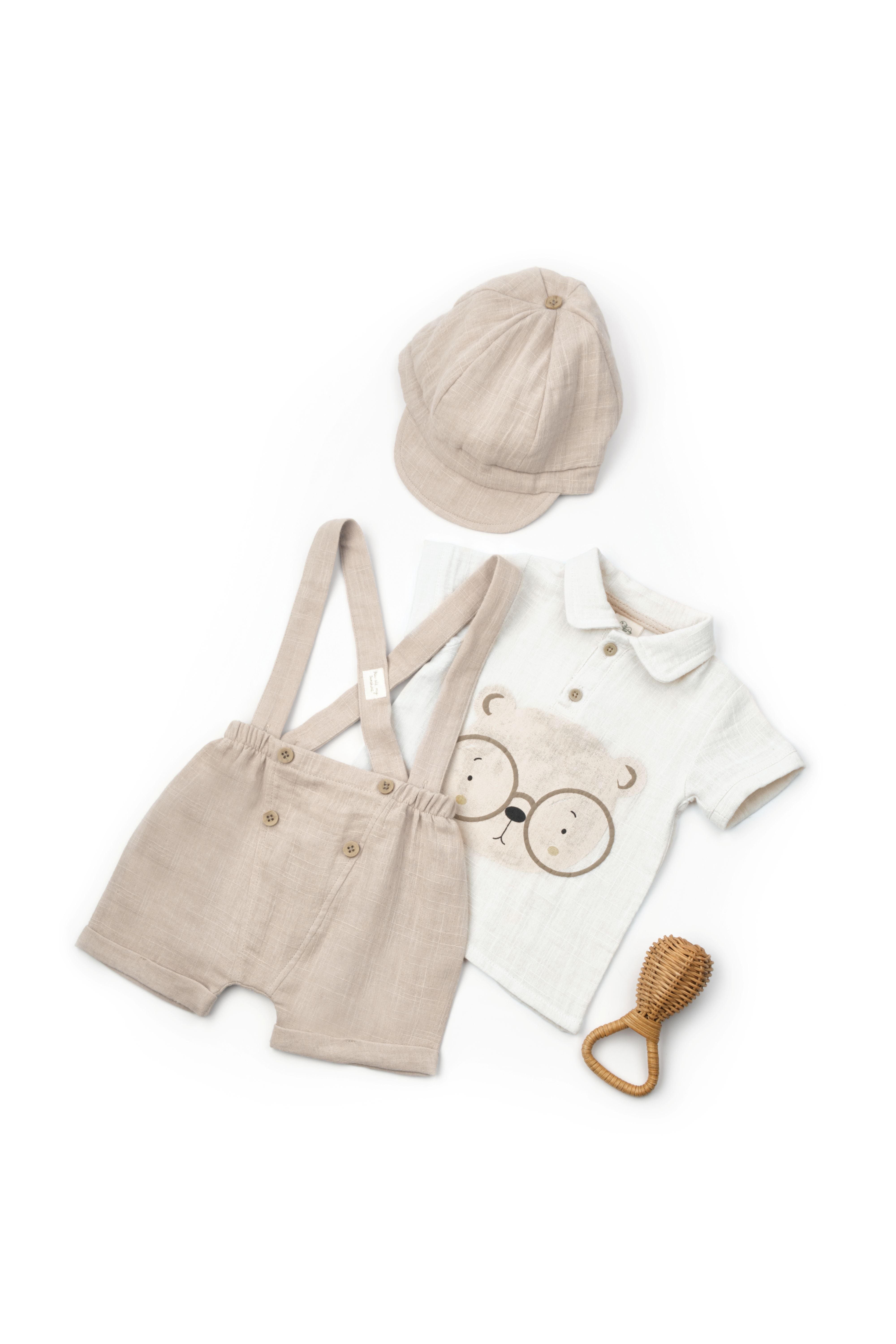 Three-piece baby boy outfit with cap and suspenders