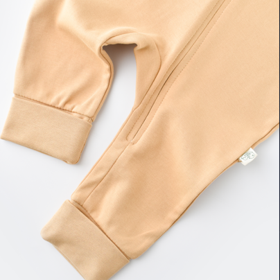 Mustard organic cotton baby onesie, durable and comfortable outfit for eco-conscious parents.