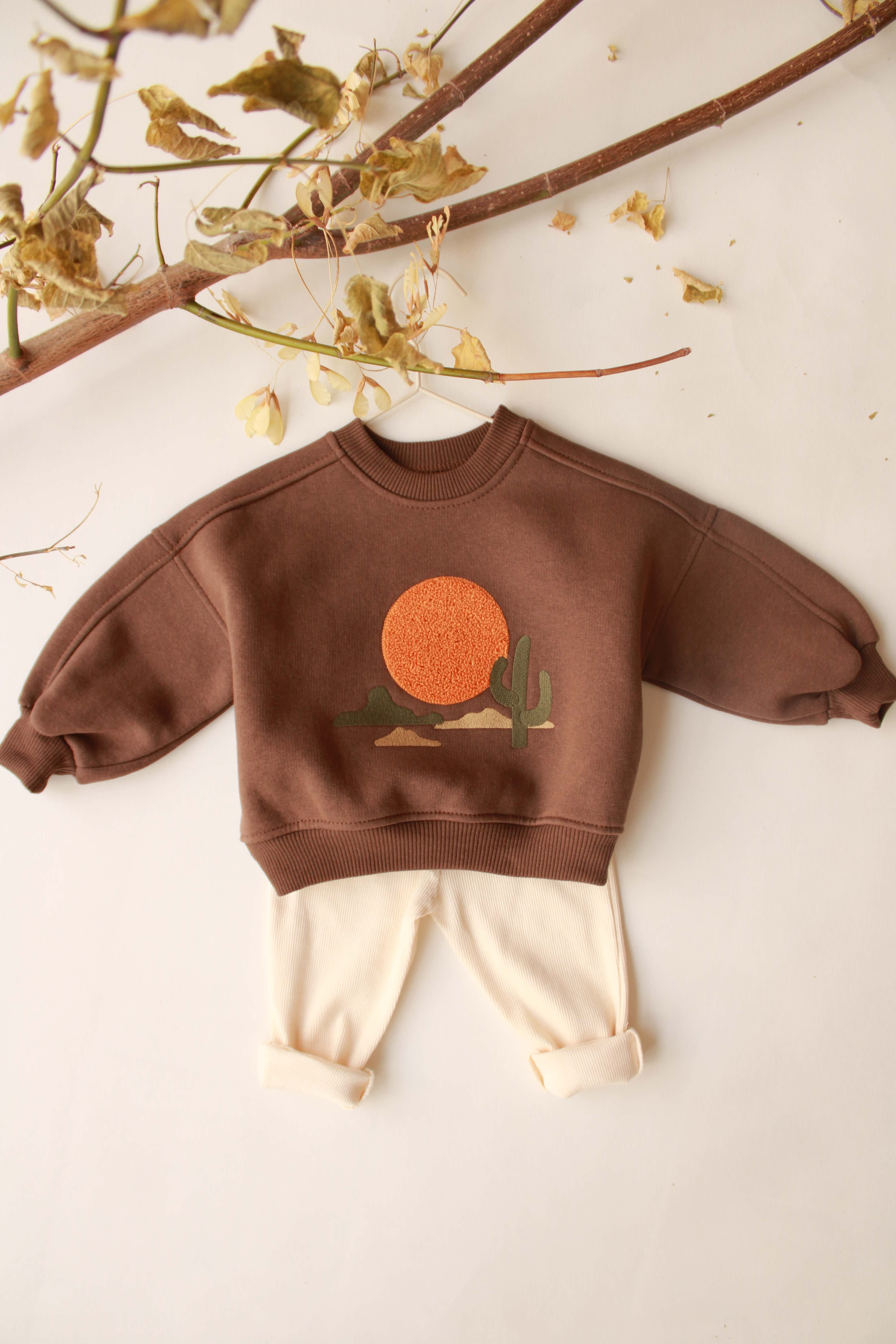 Cozy baby set featuring mountain design top and soft cotton bottoms