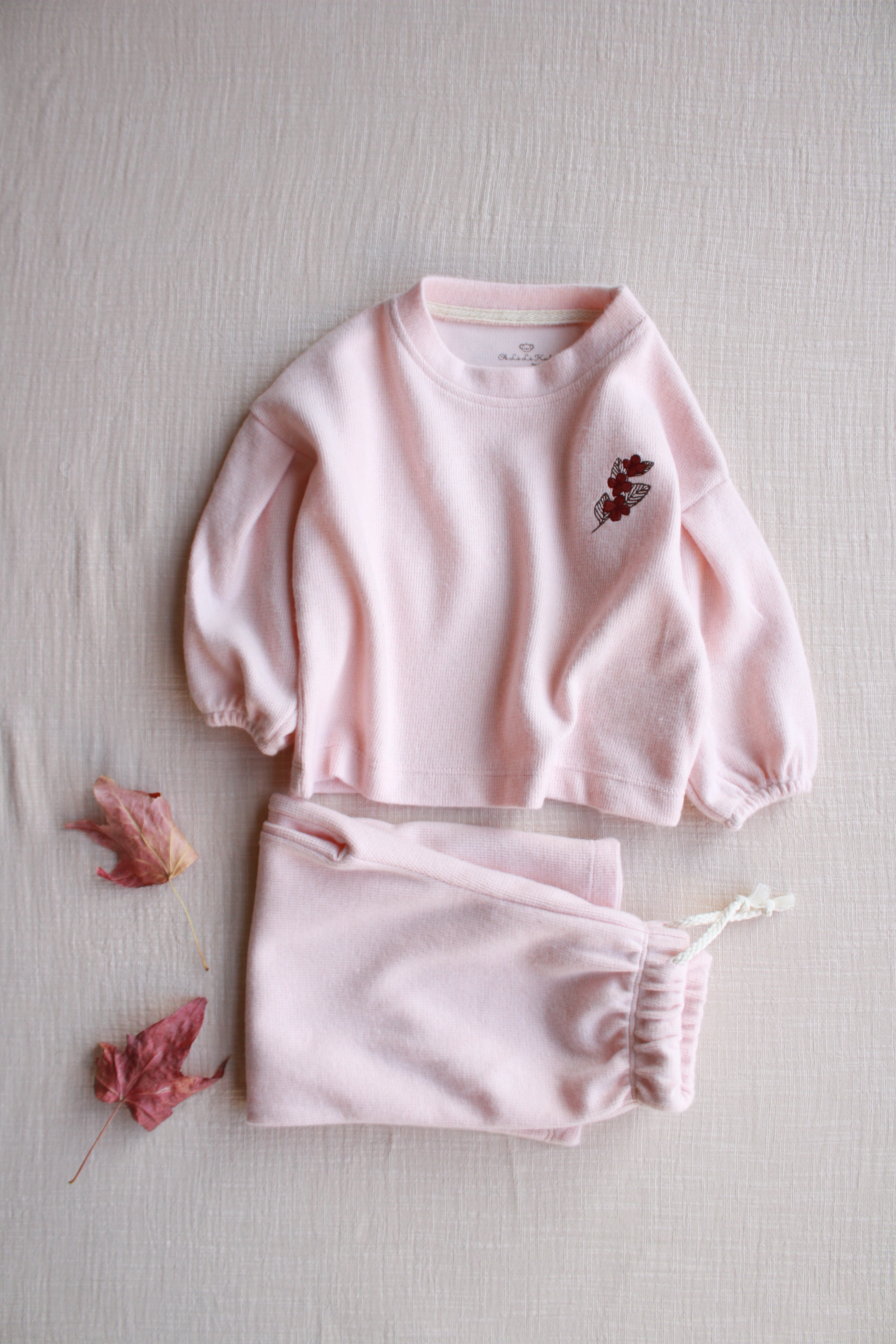 Two-piece toddler outfit in pastel pink made from comfortable cotton
