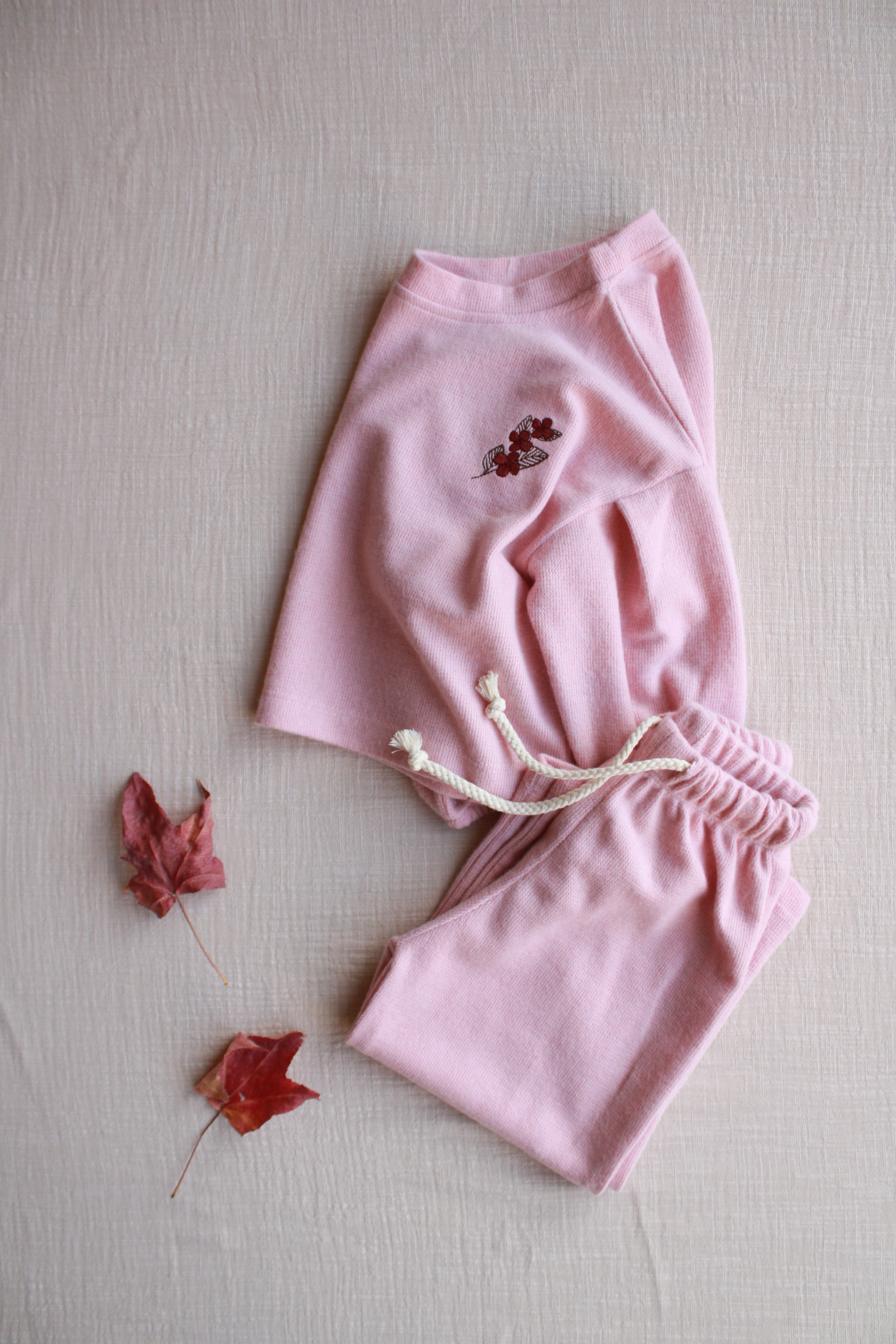 Two-piece baby lounge set in blush pink with long sleeve top and matching pants