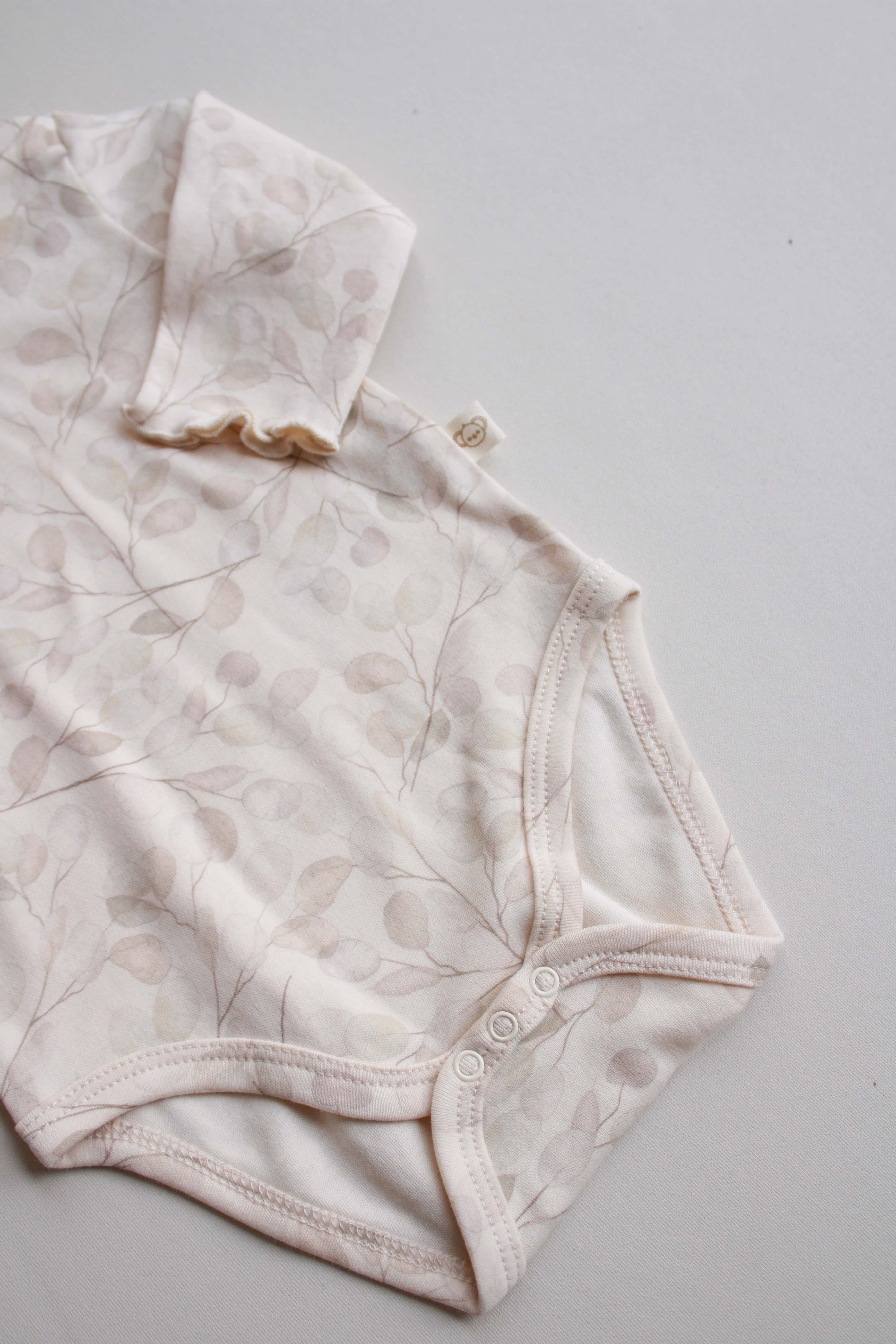 beige floral baby bodysuit and pant set for everyday wear