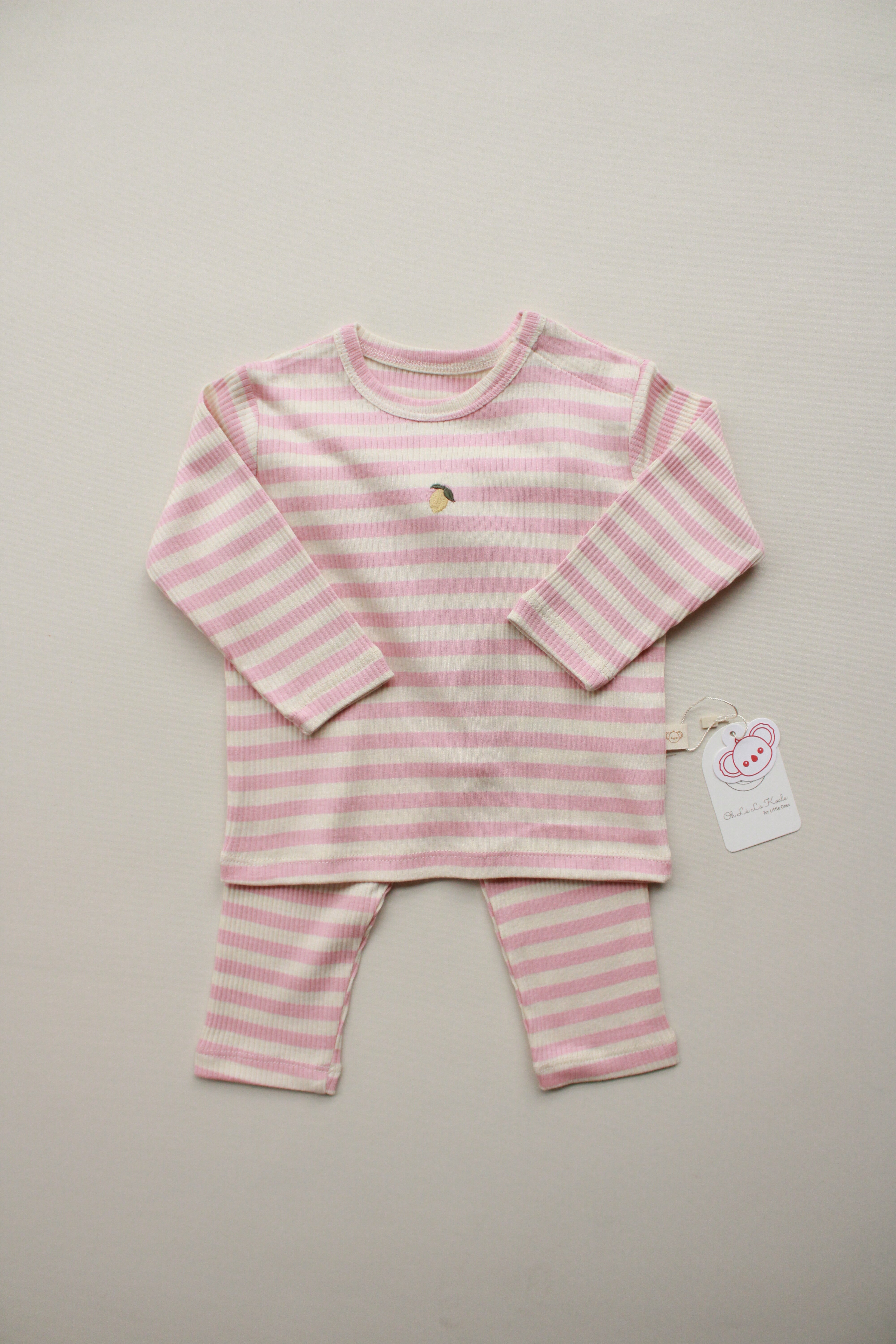 Pink and white striped baby outfit with lemon embroidery.