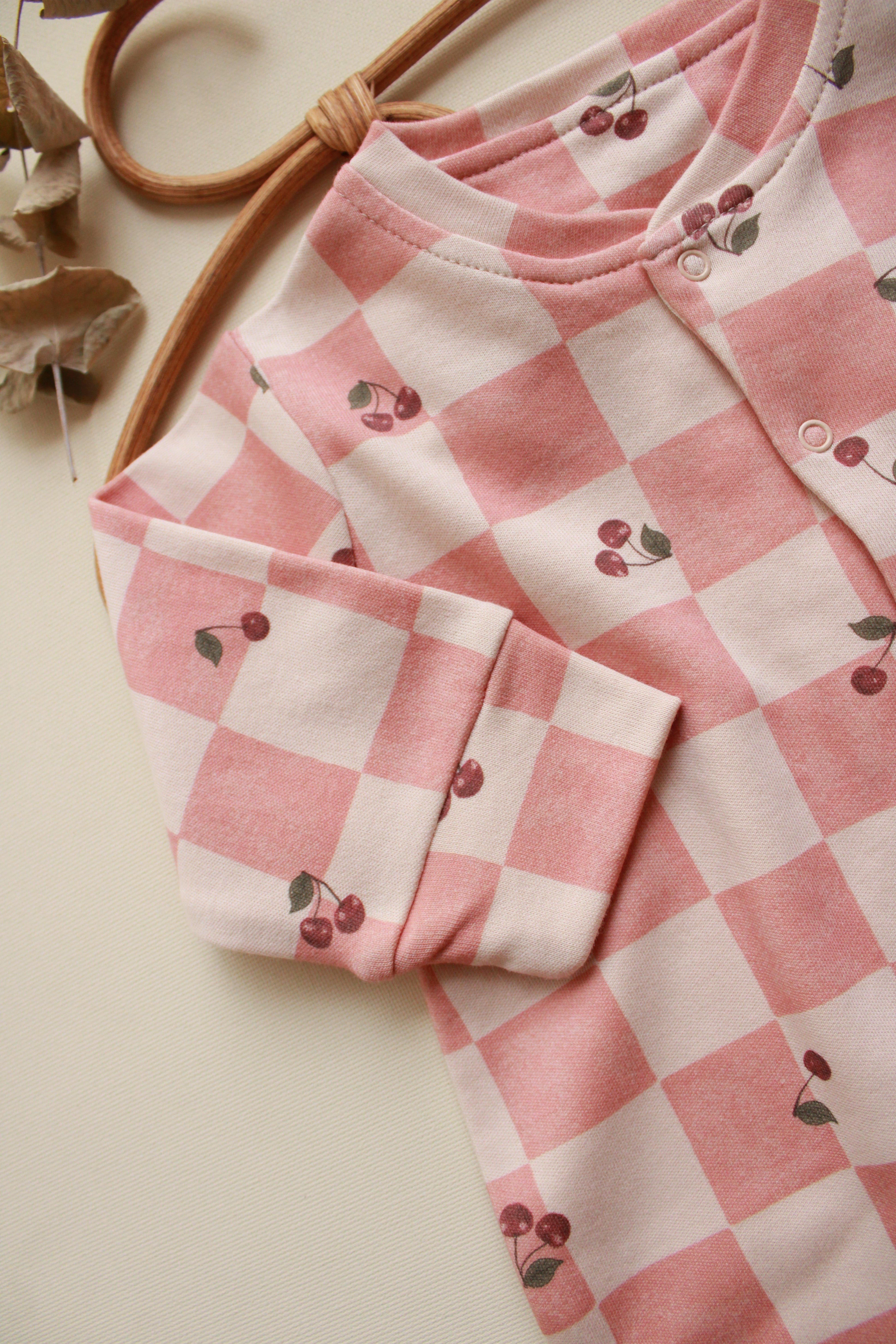 Cherry plaid baby onesie by Honey and Hive