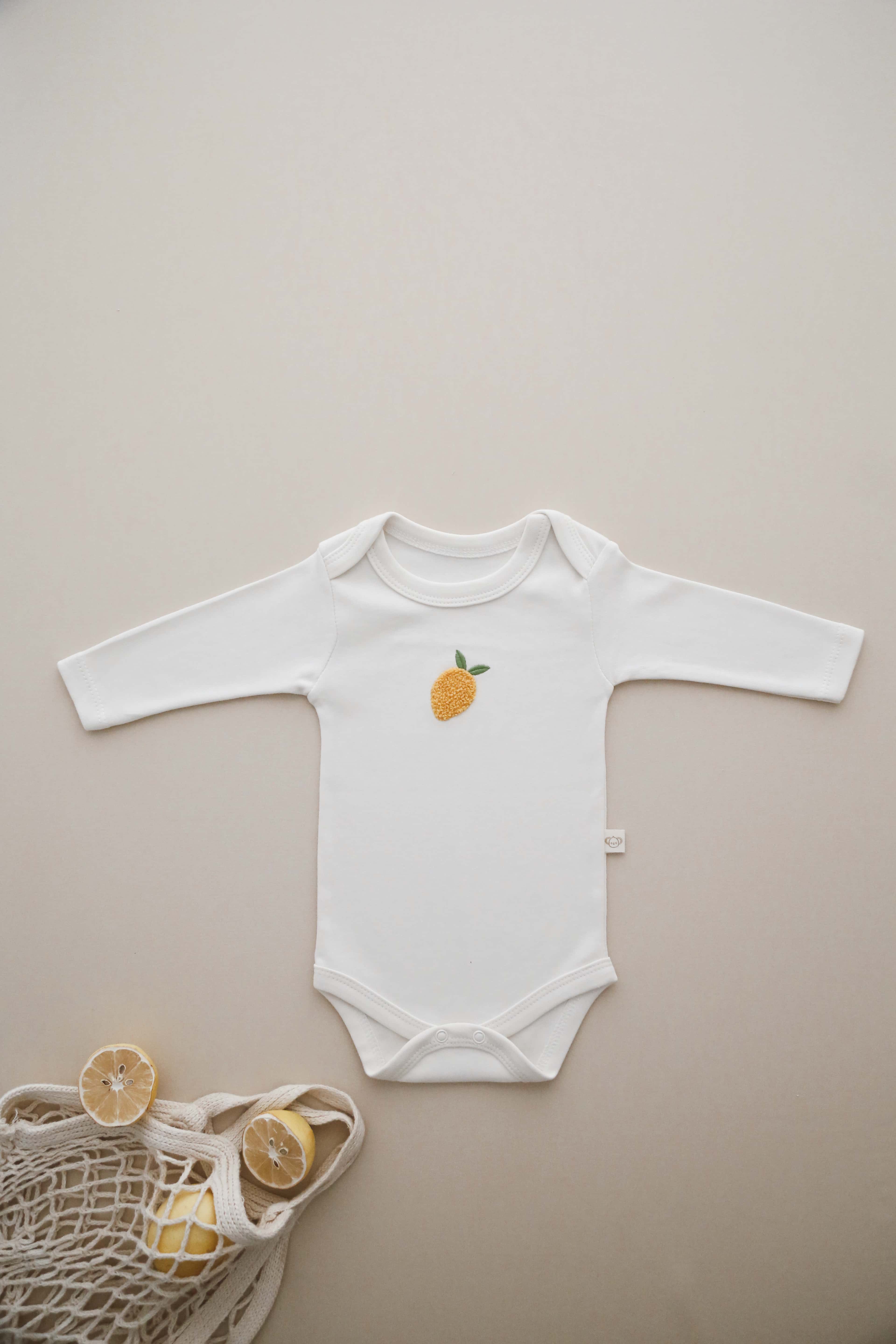 Organic cotton lemon print baby bodysuit, unisex summer outfit for newborns and infants