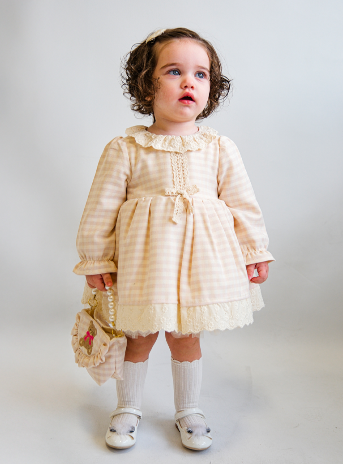 blush gingham baby girl dress with lace trim and bow