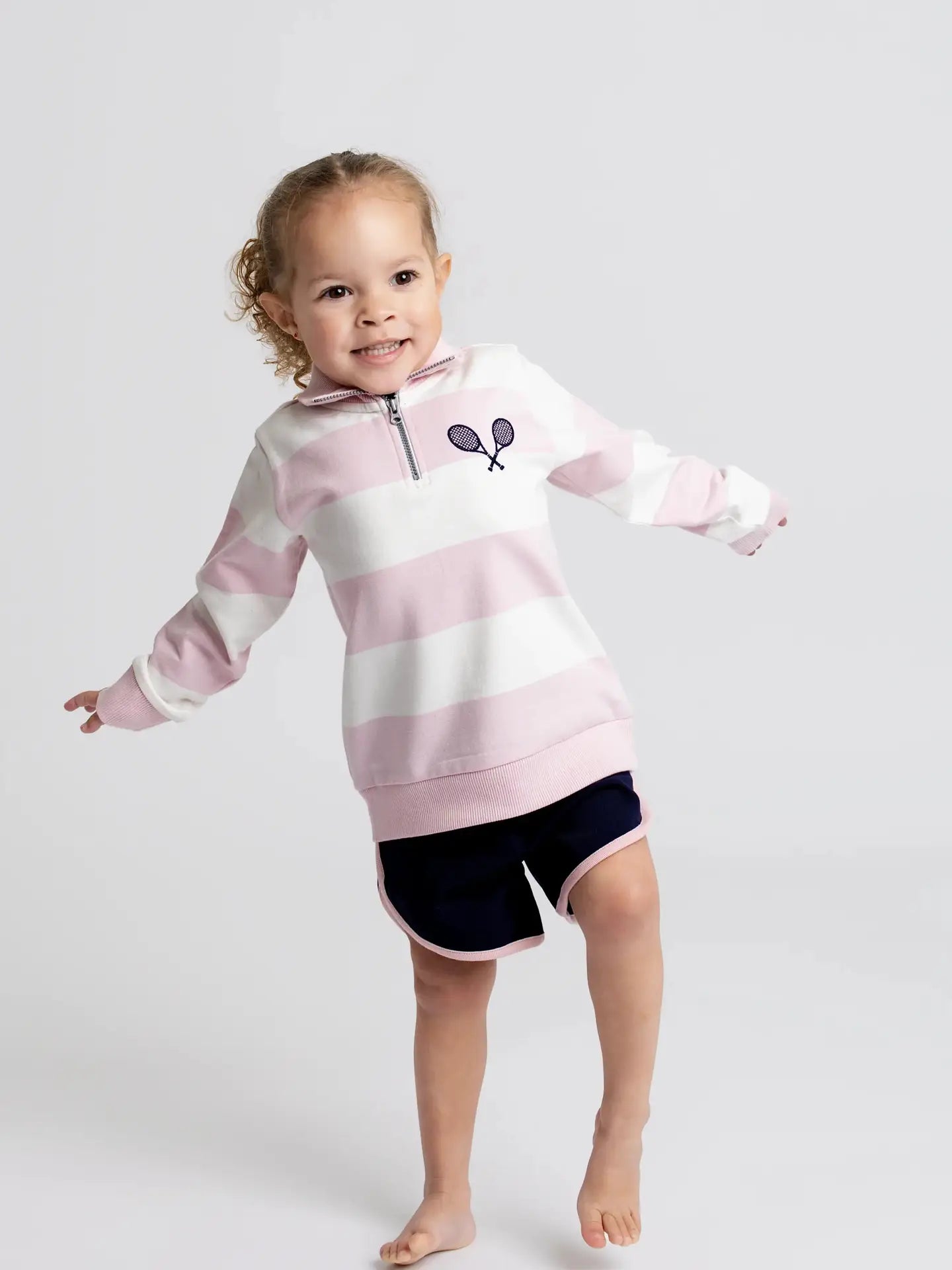 Girls pink striped Minnie Mouse tennis sweatshirt featuring Queen of Swing embroidery on the back.