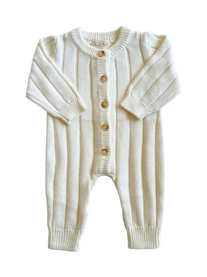 Soft ivory organic knit one-piece for babies.