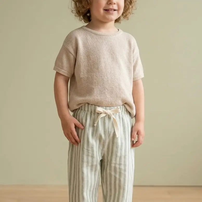 Organic linen stripe kids pants with adjustable drawstring waist.