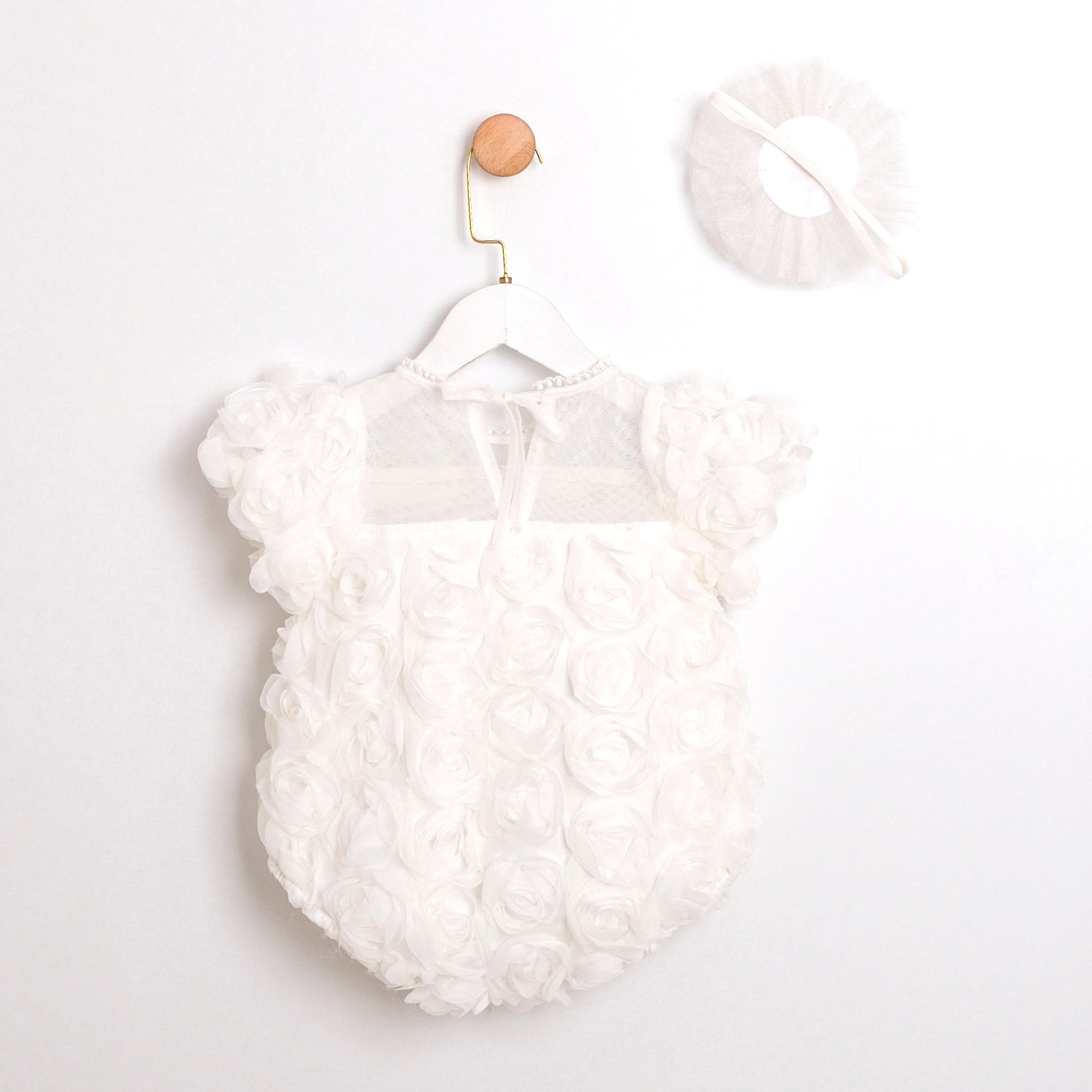 Baby girl Pearl Rose romper in white, breathable cotton clothing for toddlers and infants.
