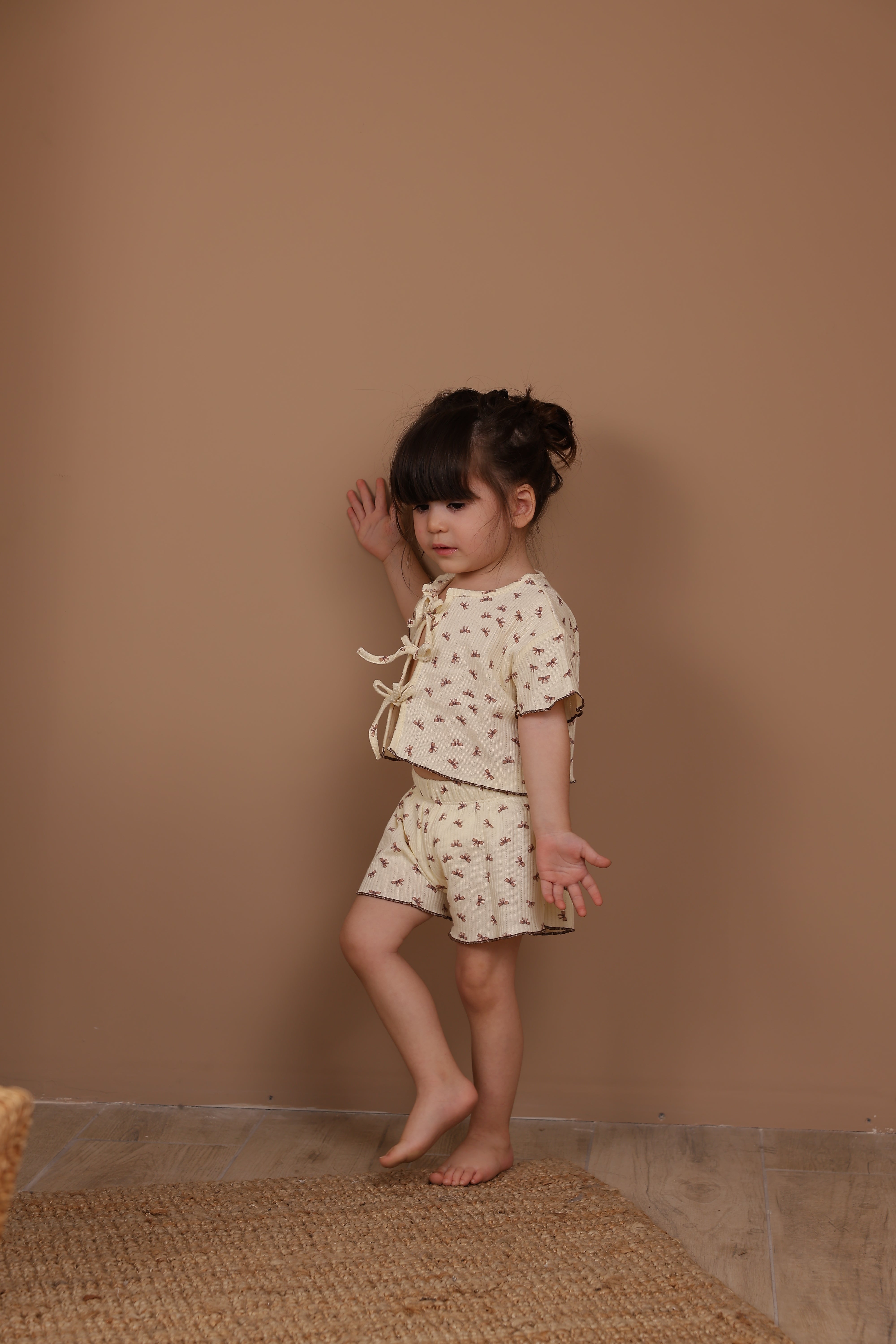 Adorable petite bow tie-front set for babies, breathable cotton outfit perfect for newborns.