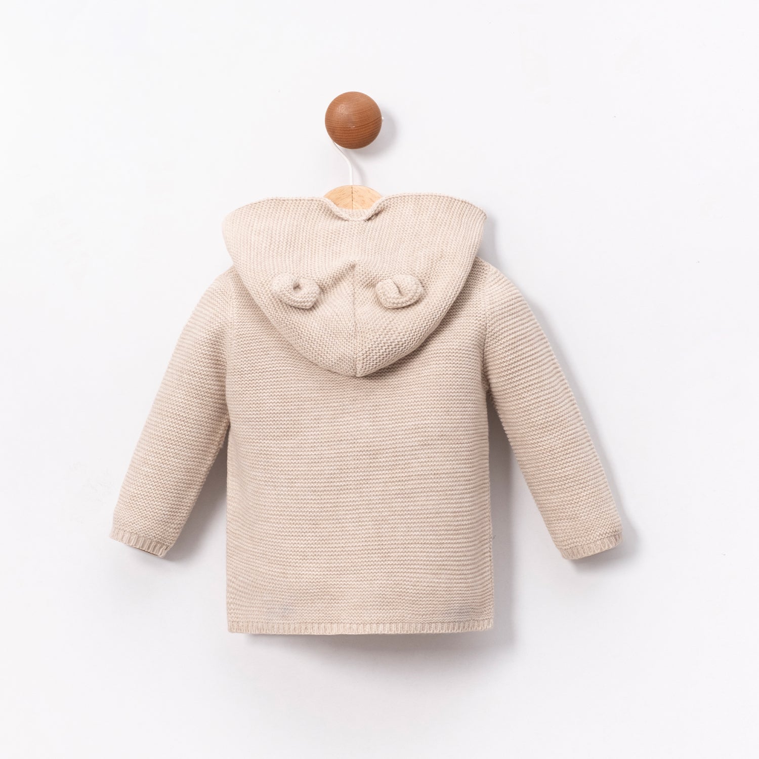 Beige Lenora sweater for babies, soft infant clothing designed for daily wear and comfort.