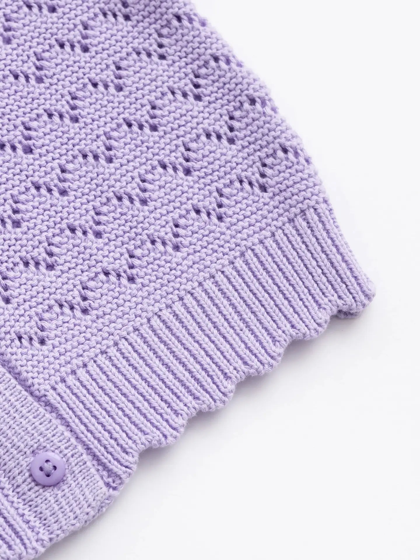 Lightweight lavender baby sweater cardigan made from breathable organic cotton.