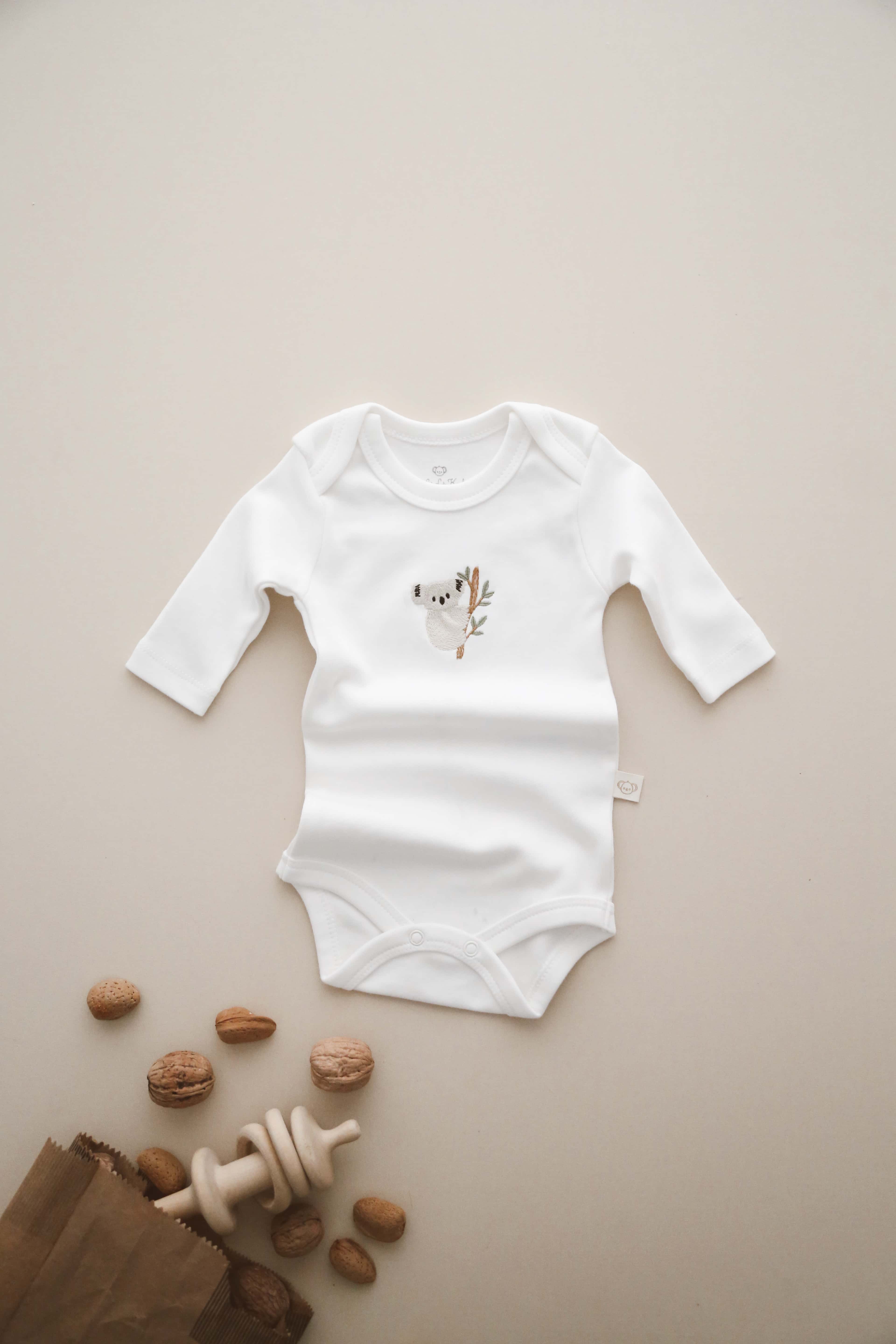 Koala patterned long sleeve baby bodysuit, soft organic cotton outfit for newborns and toddlers