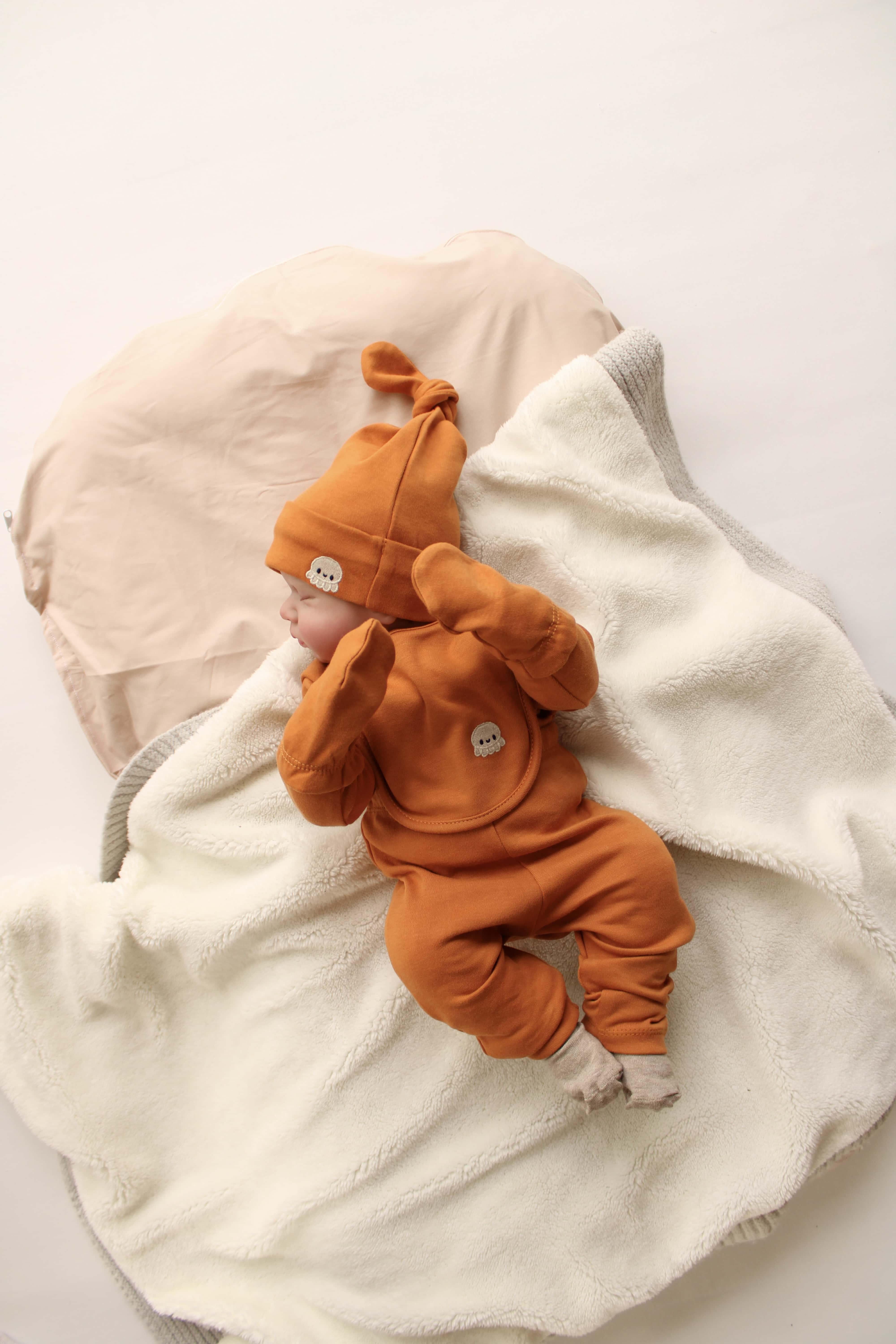 Octopus patterned 5 piece newborn gift set, organic cotton baby essentials for comfort.