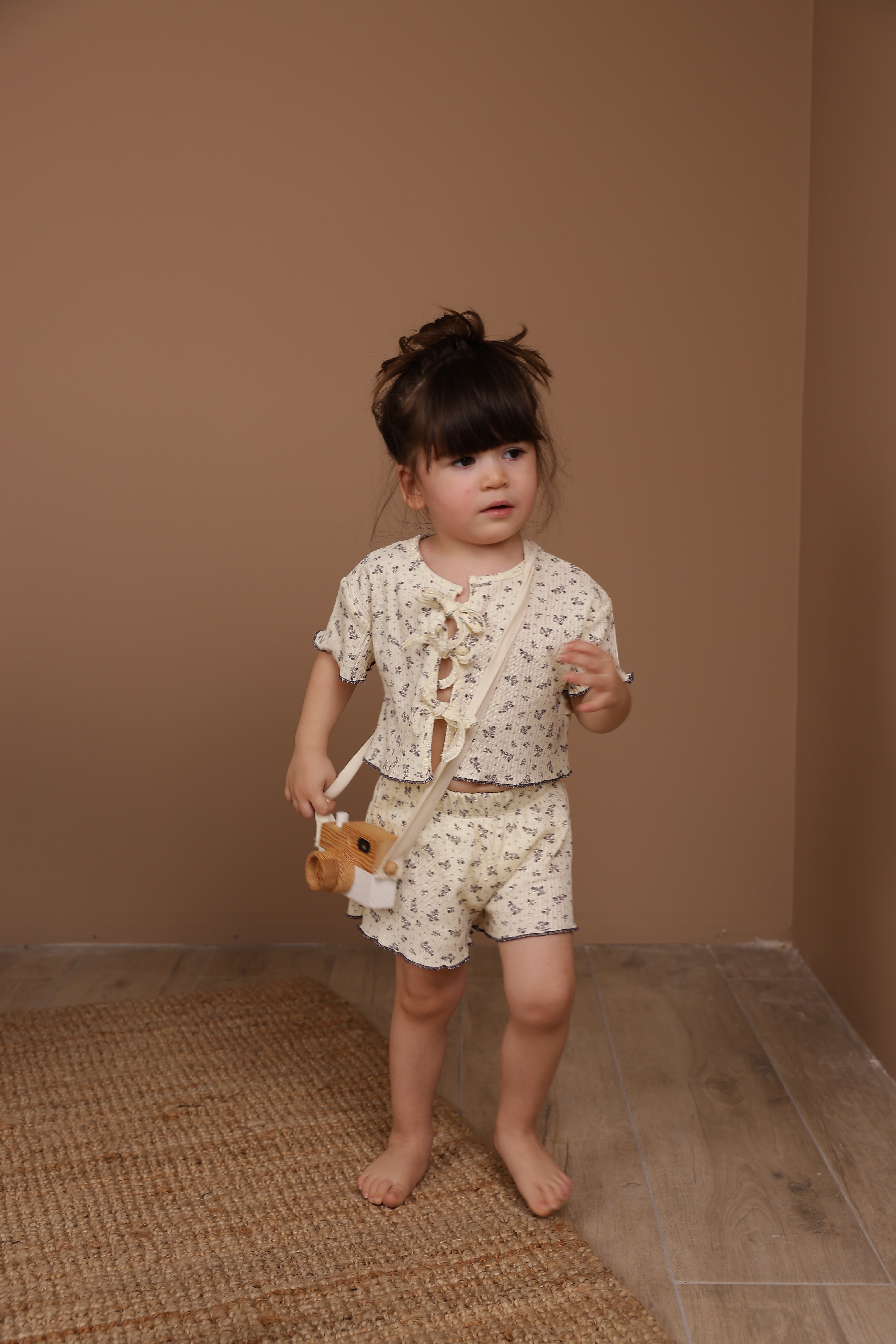 Organic cotton wildflower tie-front set, cozy unisex baby clothing for everyday comfort.