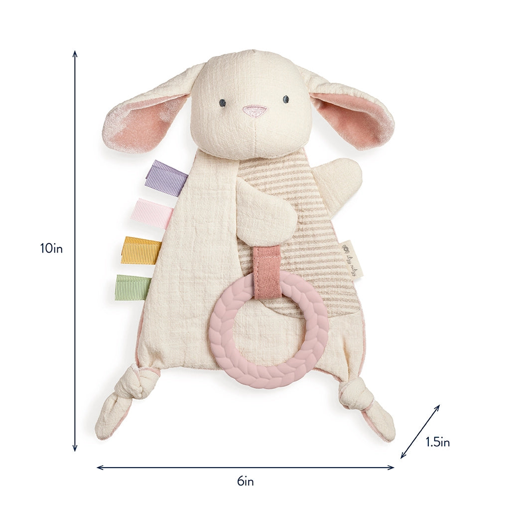 Baby holding soft bunny teether lovey