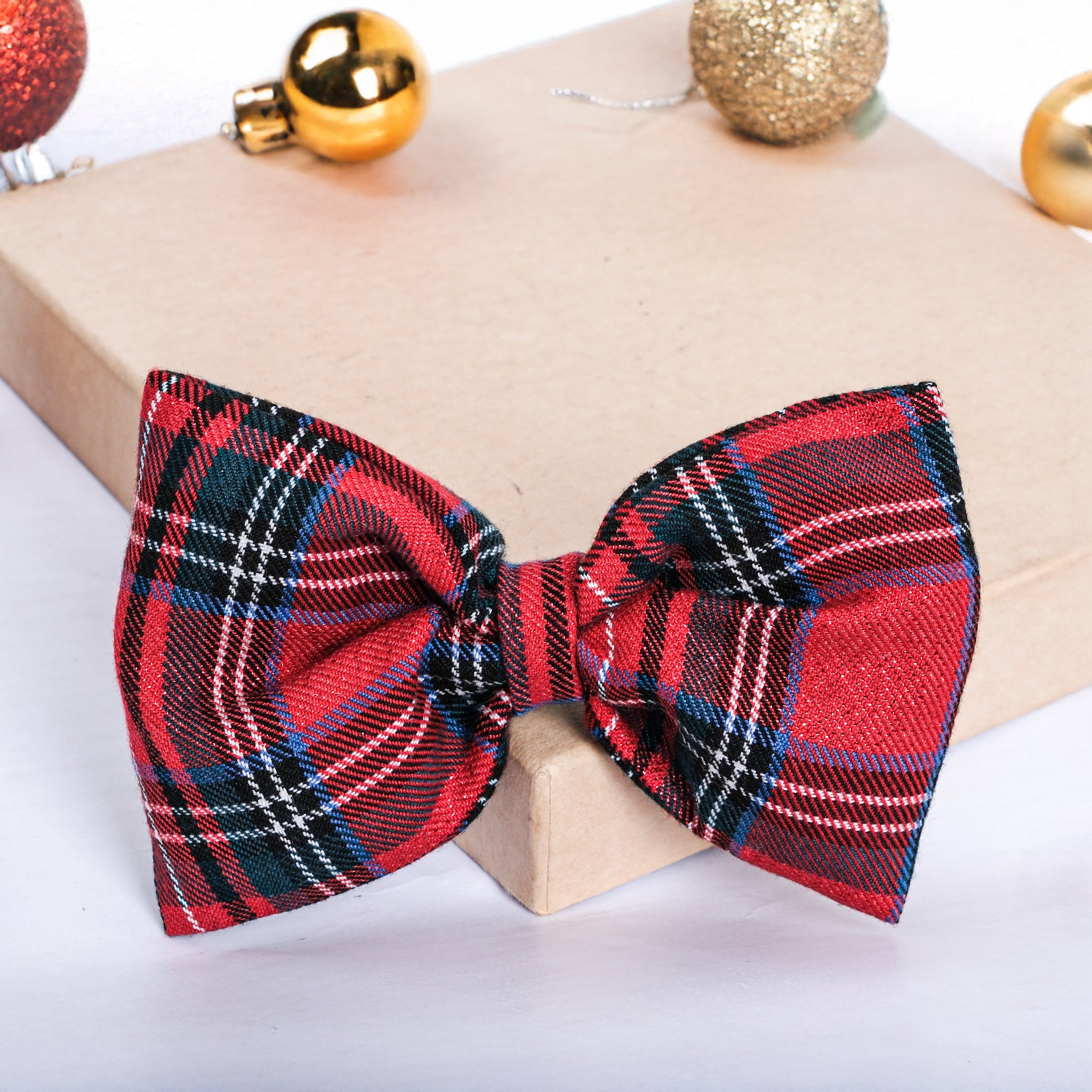 Red plaid tartan bow for babies and kids, perfect for holidays.