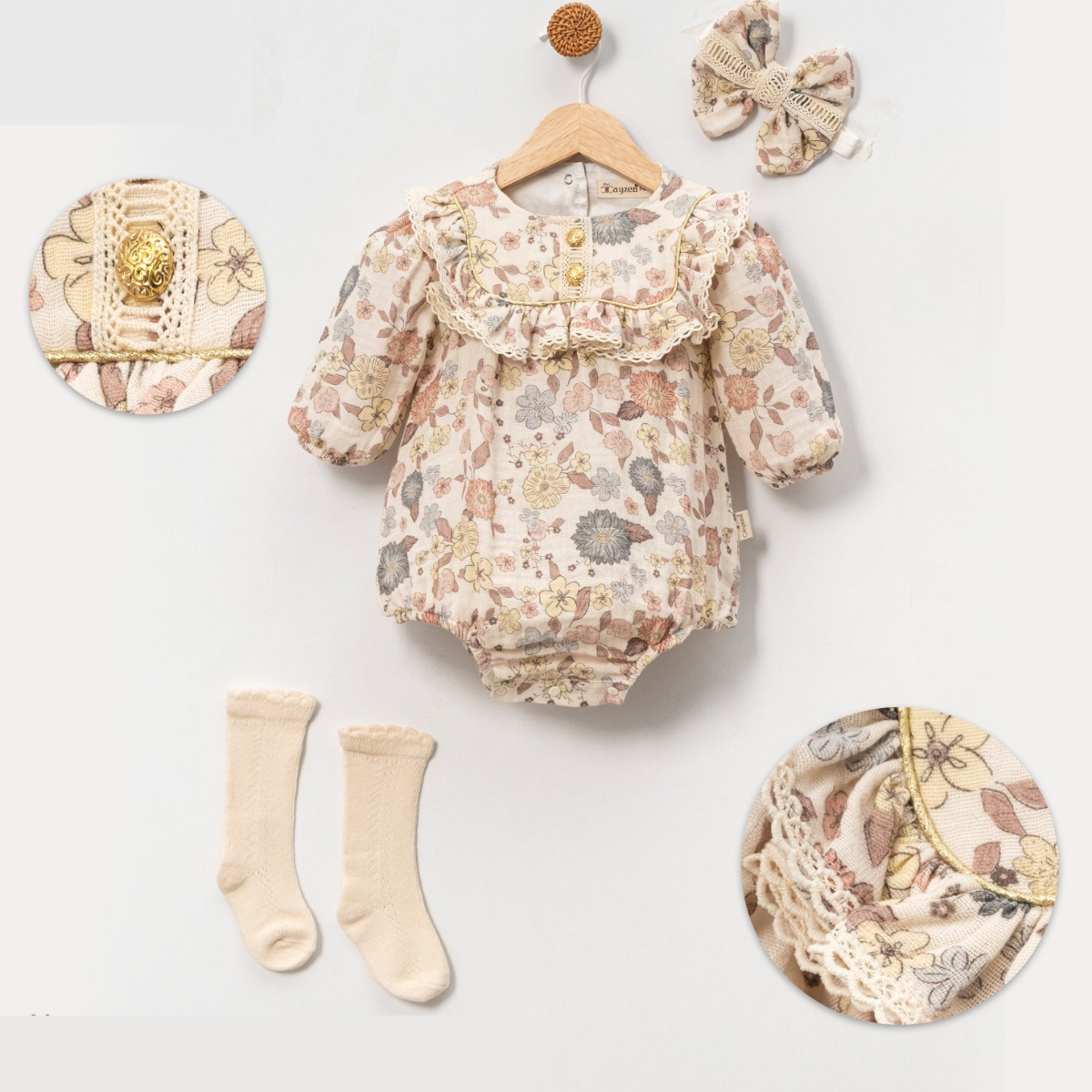 Vintage-style baby romper set in pastel floral print with lace details.