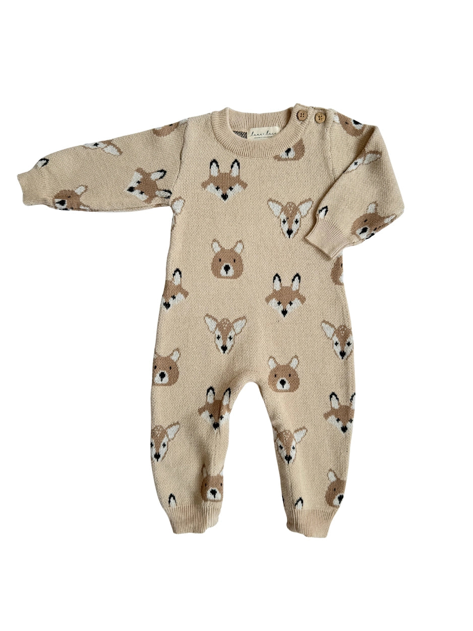 beige knit jumpsuit with bear, fox, and deer print