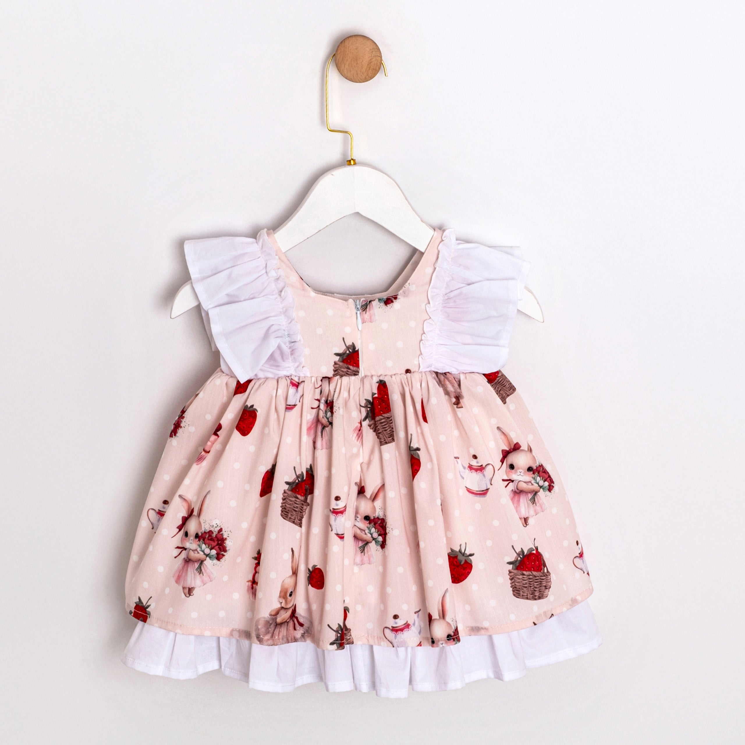 Pink baby dress with ruffle straps and bow details