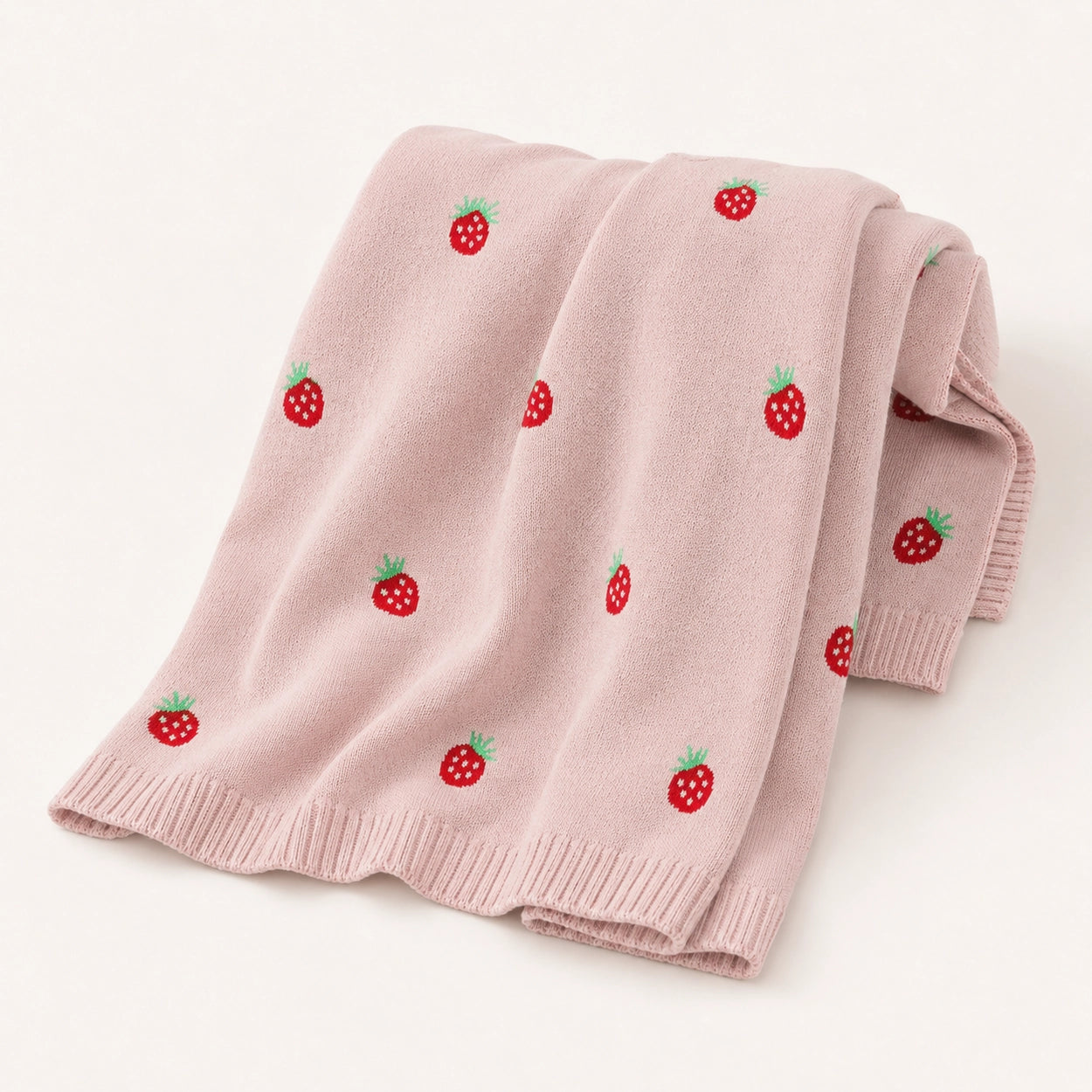 Soft pink strawberry baby knit blanket made from breathable cotton