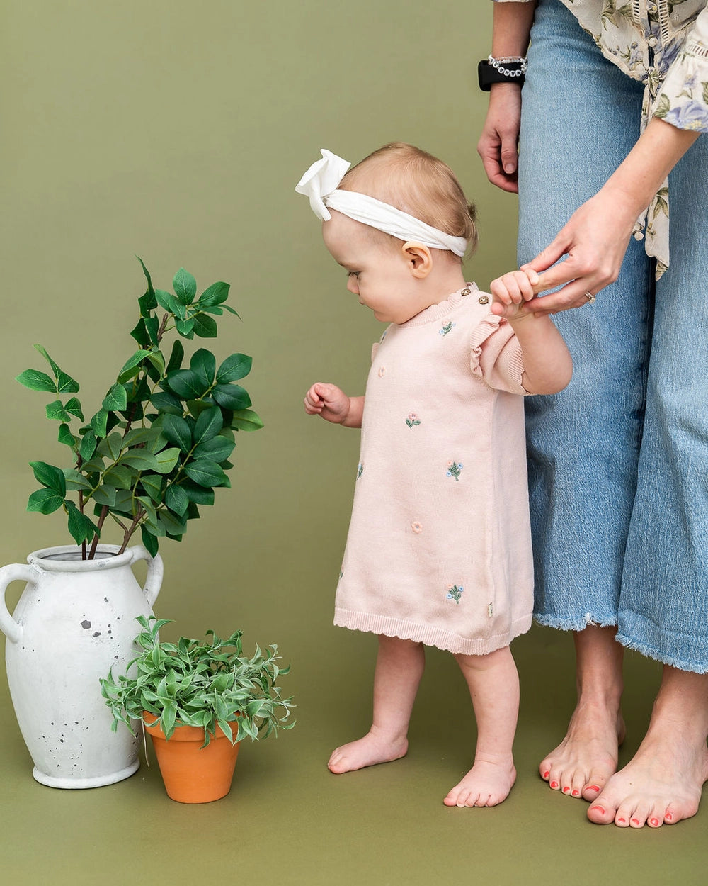 floral embroidery detail on pink organic cotton dress