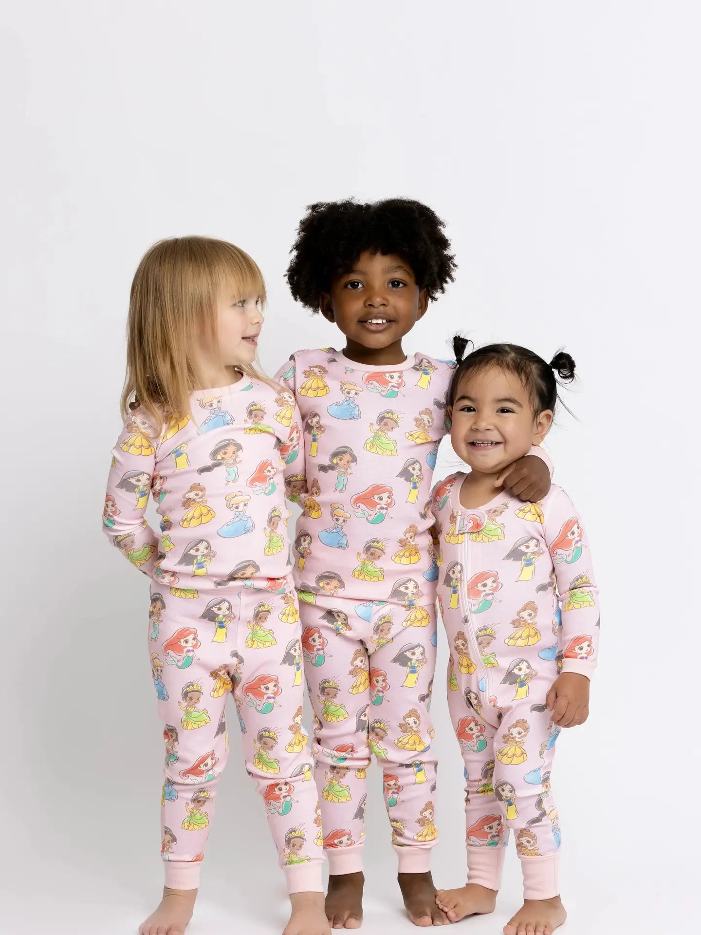 Soft long sleeve Disney Princess pajamas for girls with matching pink pajama pants.