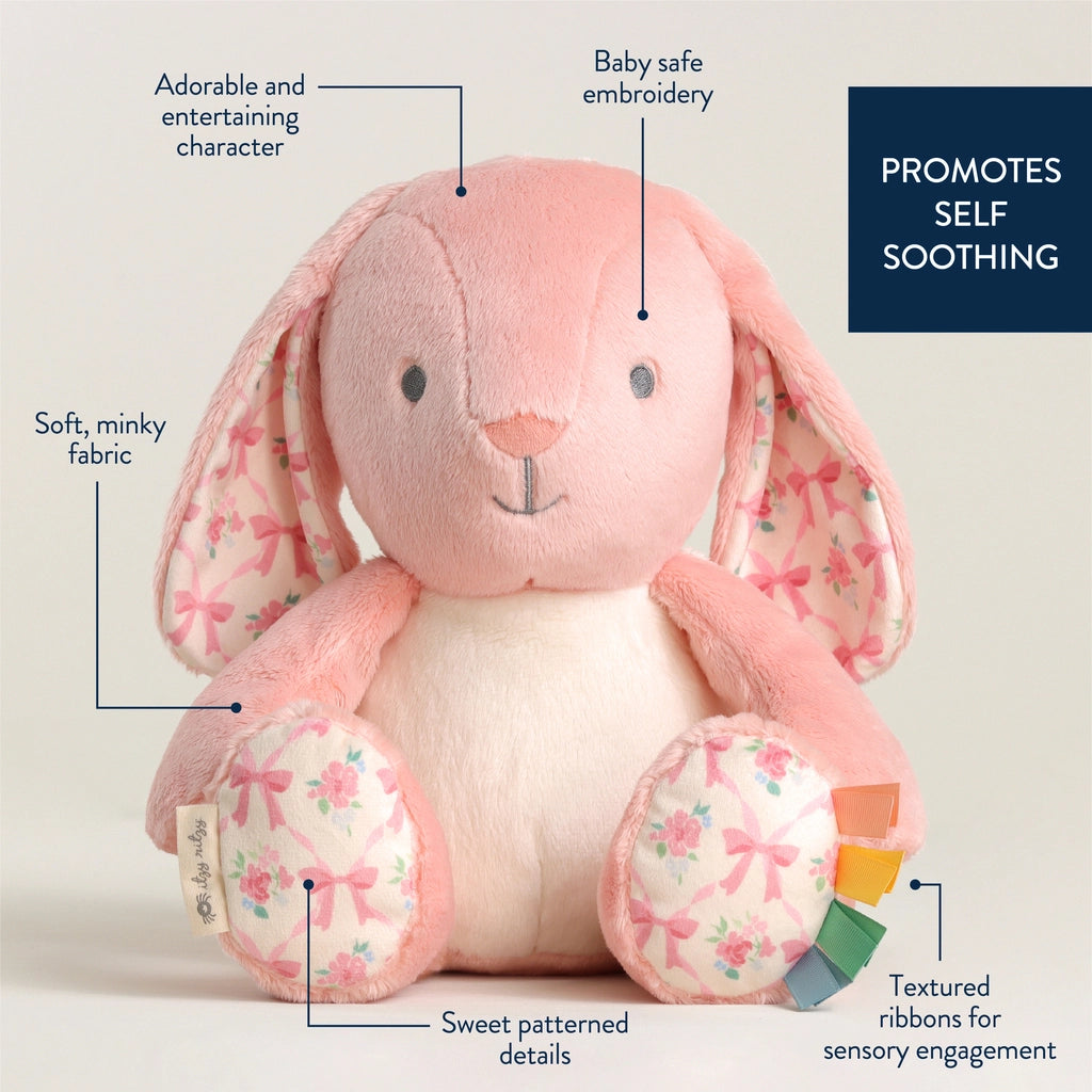 Blush pink stuffed bunny with floral patterned paws