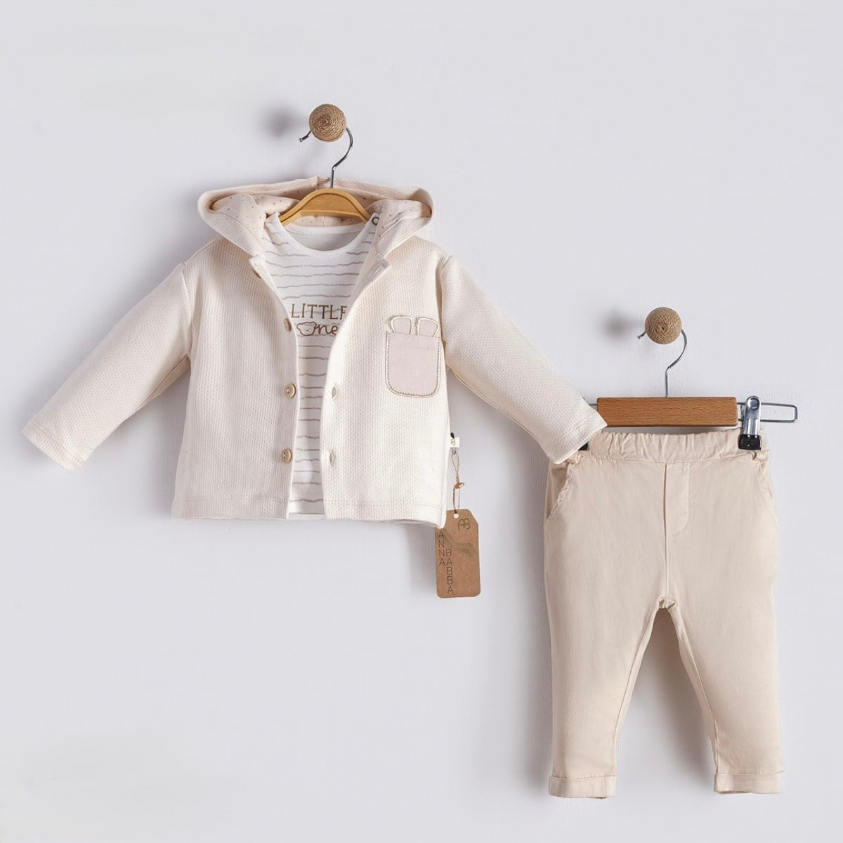 Neutral baby outfit with hooded jacket, bodysuit, and pants